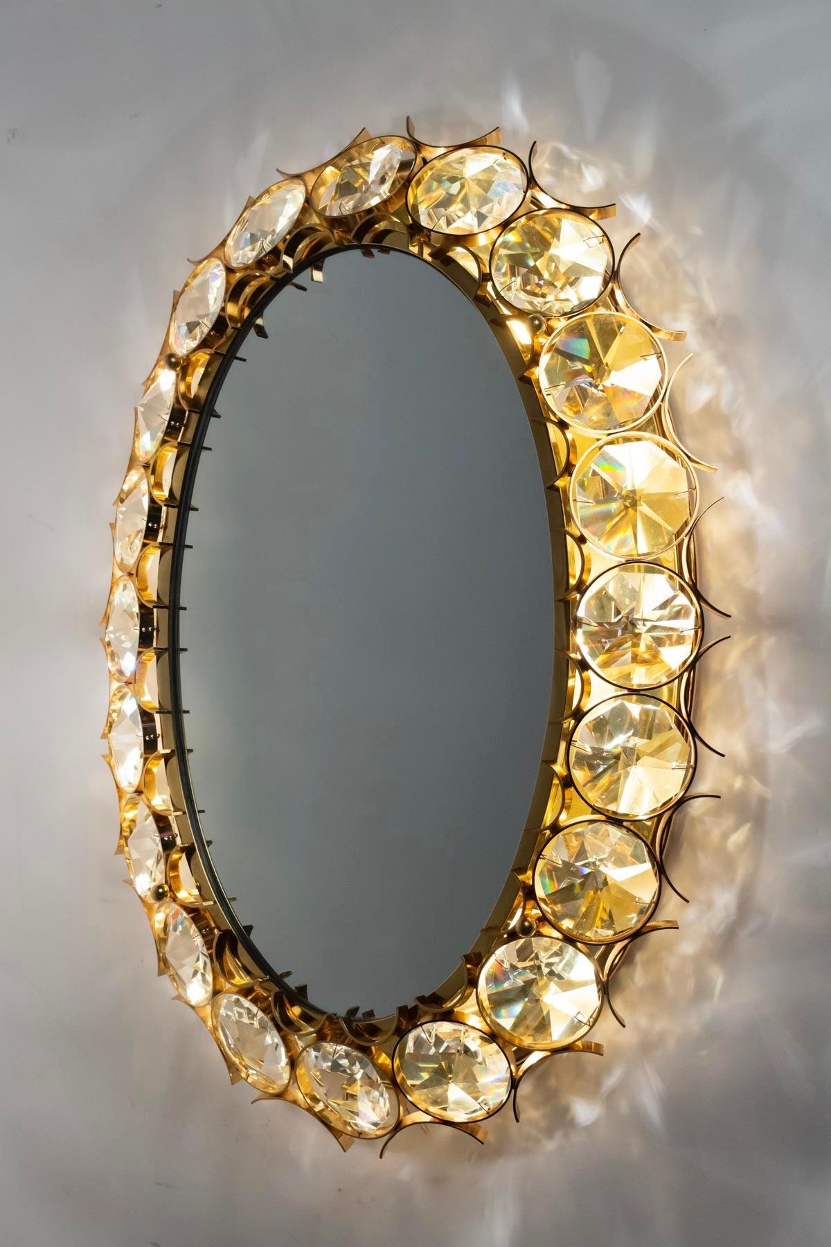 Fancy pair of backlight mirror. Made of gilded steal and adorned with crystal jewels.
In the taste of Max Ingrad
8 lighted arms.

  