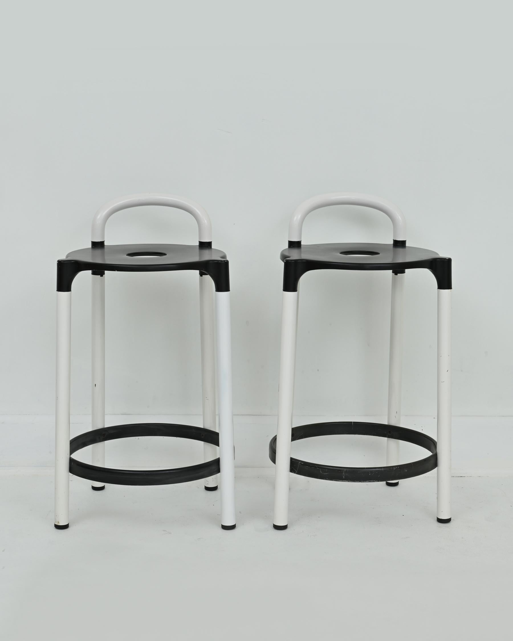 27” high x 18” deep x 16” wide. Seat height: 21.5”

1980s pair of postmodern stools by Anna Casatelli Ferrieri for Kartell. Made in Italy. Black and white colorway. In good vintage condition with some signs of wear and varying shades of white paint