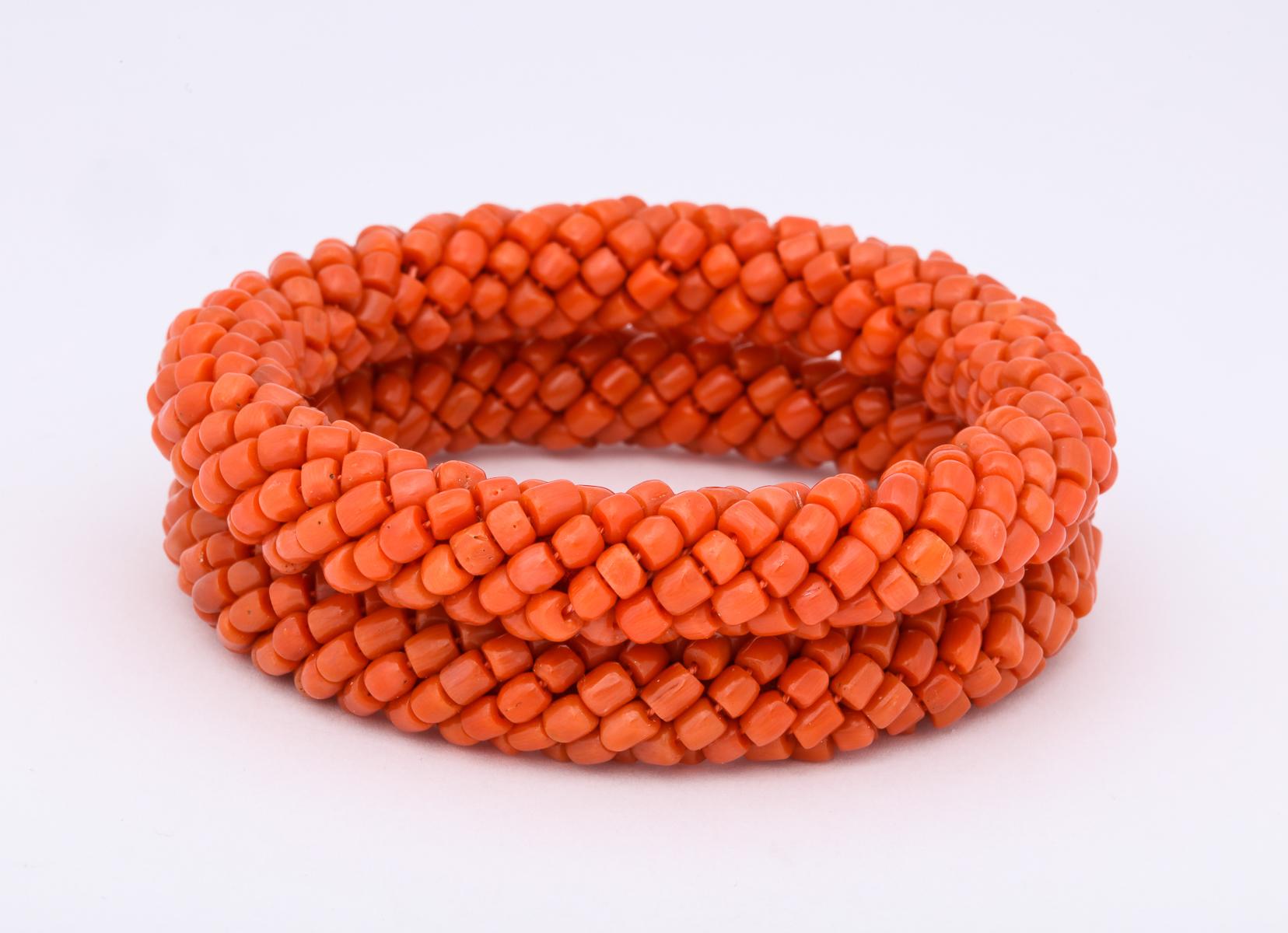 One Pair Of Ladies Criss Cross Basket Weave Design Coral Bead Hard Bangles . One Bangle Measuring 1/2 Inch Approx. Width Other Bangle Measuring A Little Smaller Than 1/2 Inch. Designed In The 1980's In The United States Of America.NOTE: Fits A Over