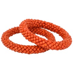 1980s Pair of Braided Design Criss Cross Coral Beads Hard Slip on Bangles