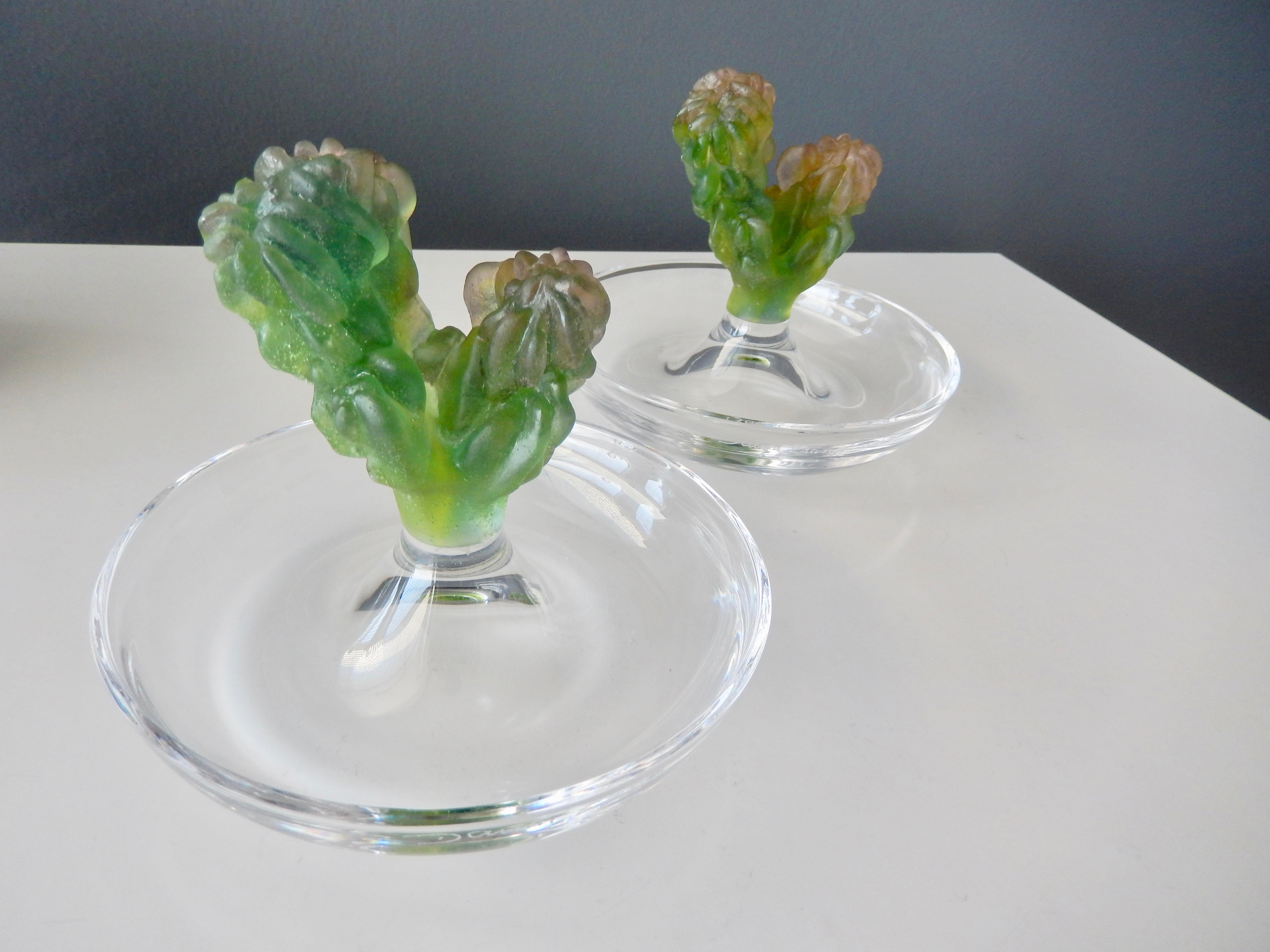 A pair of crystal dishes by Daum with a pâte de verre cactus design by the American artist Joseph Hilton McConnico (1943-2018). In 1987 McConnico collaborated with Daum and created his iconic 