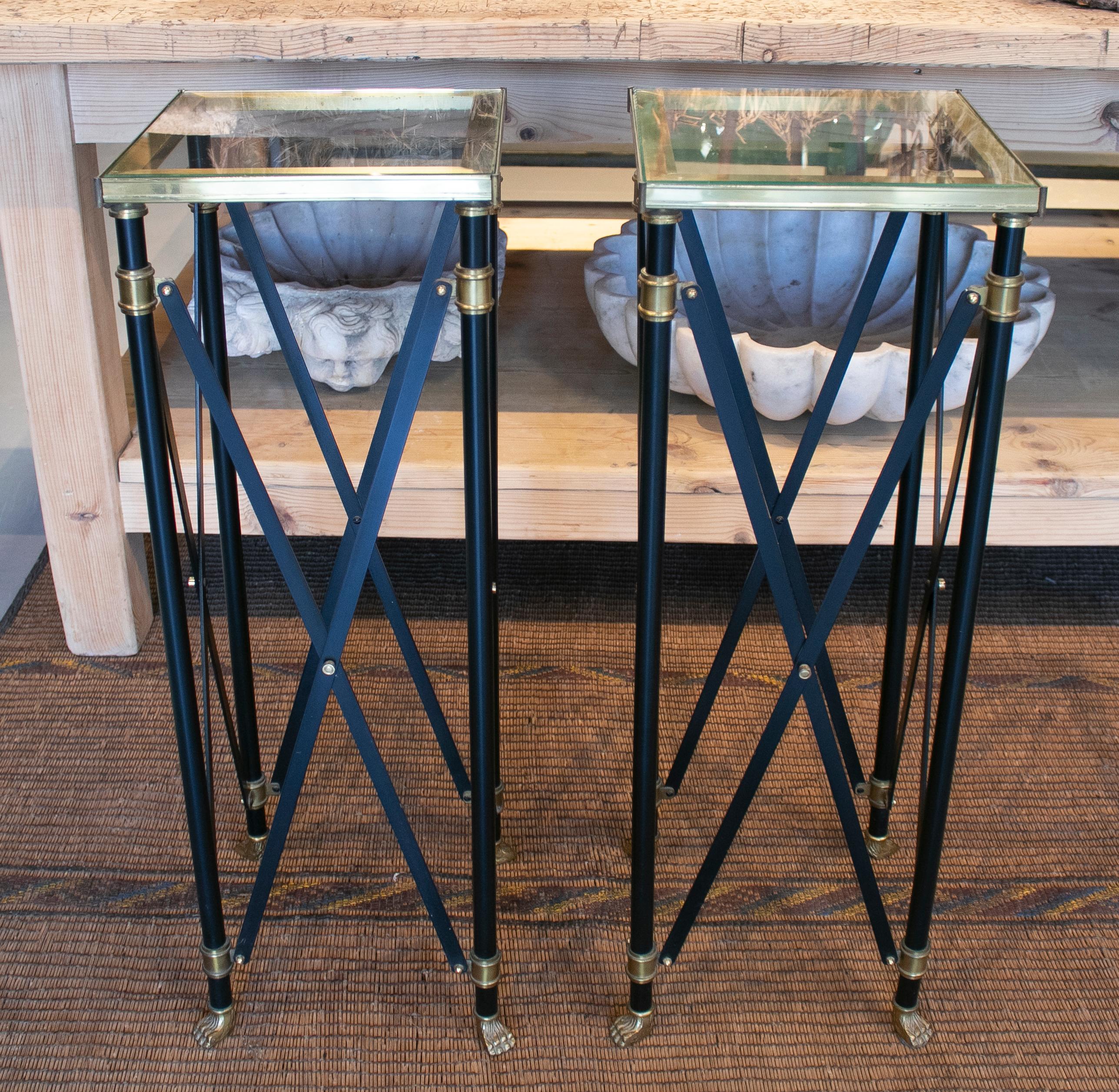 1980s pair of French designed bronze auxiliary tall tables with lion claw feet.