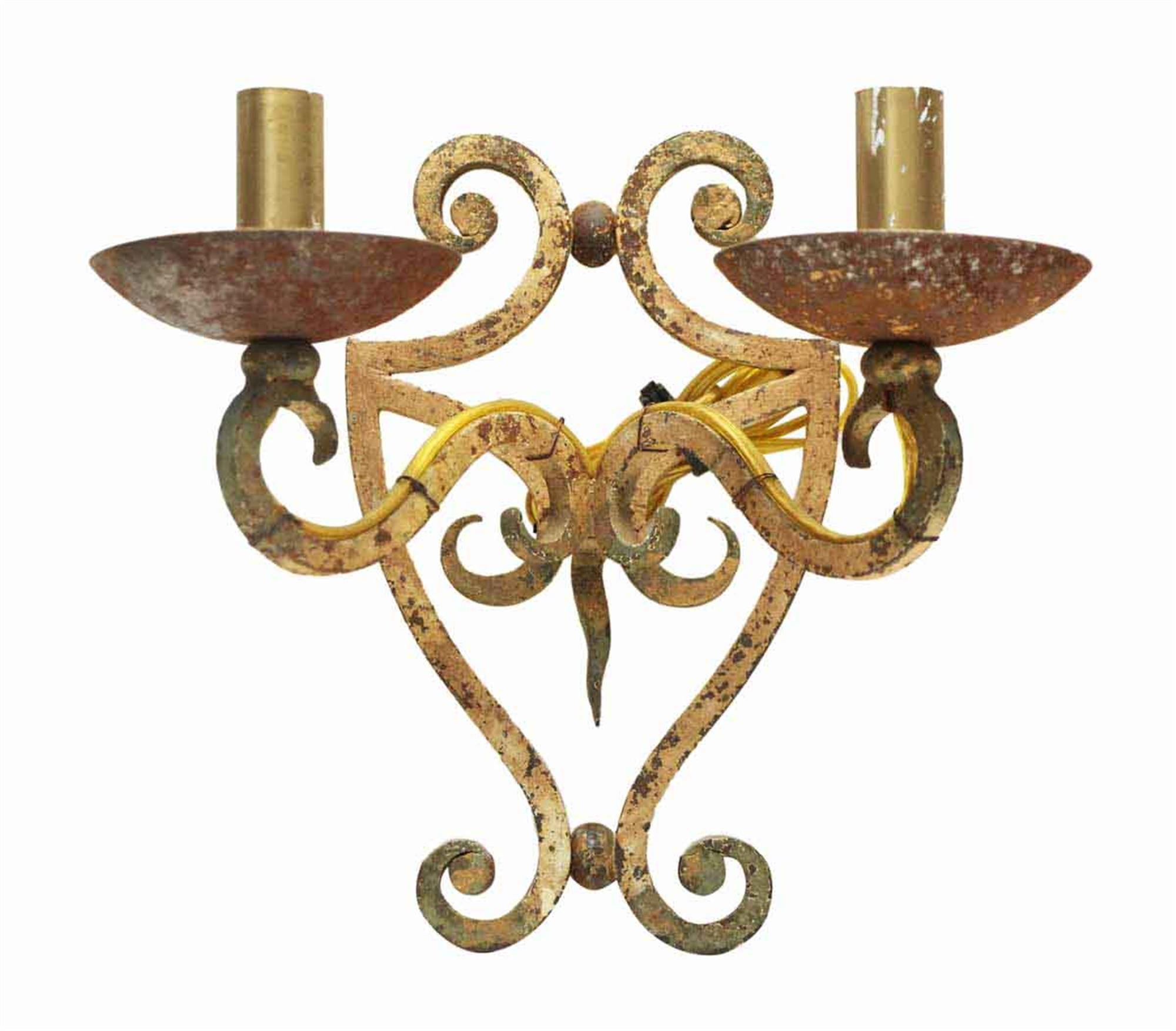 1980s distressed light tan painted iron two arm sconces. They have been recently wired. Sold as a pair. This can be seen at our 400 Gilligan St location in Scranton, PA.