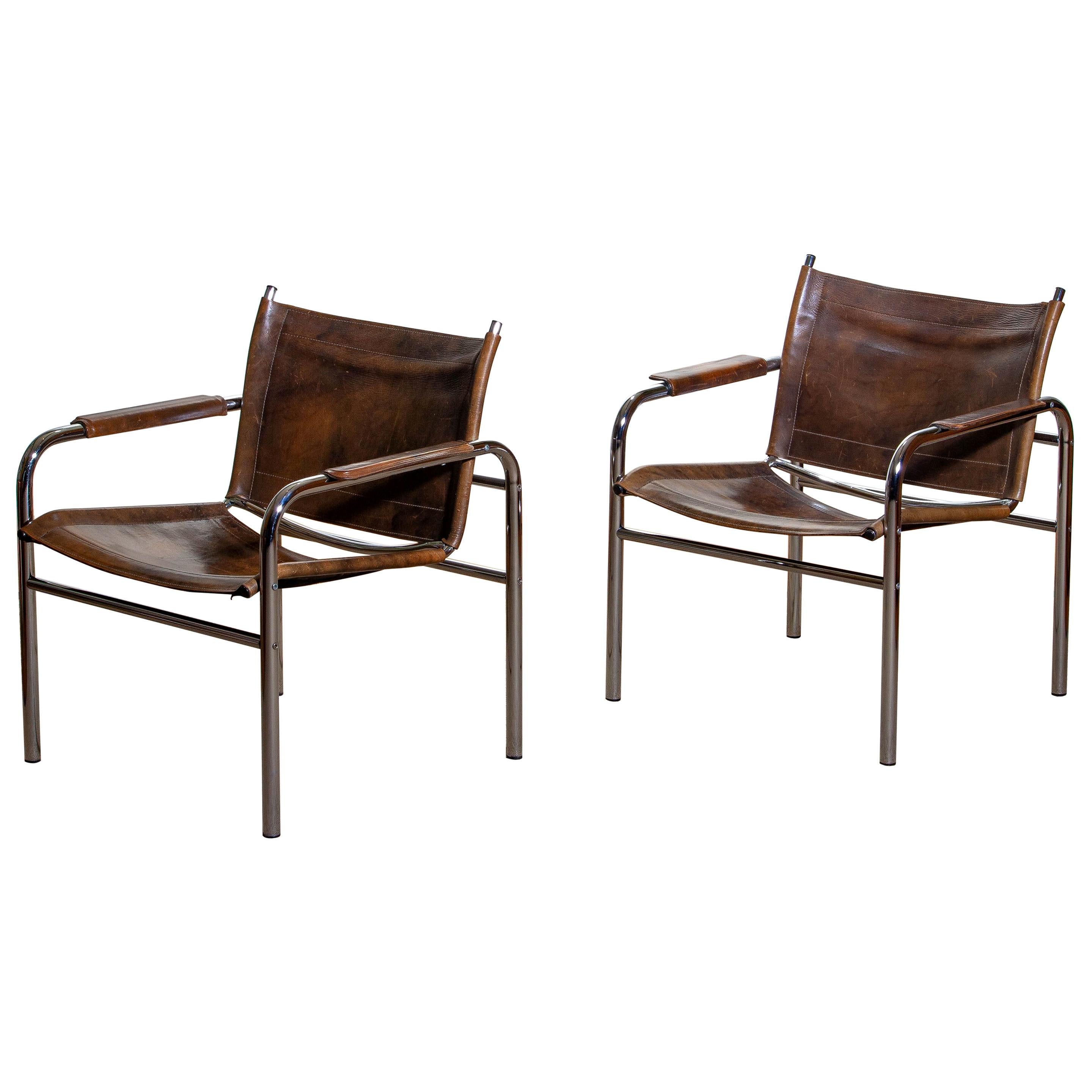 Beautiful pair of armchairs, model Klinte, designed by Tord Bjorklund, Sweden. The chairs having a tubular chromed steel frame with brown-taupe leather back / seating and armrest with a beautiful patina.
Period: 1980.
  
