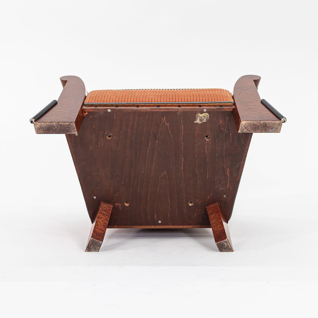This is an important pair of Post-Modern lounge chairs designed by Michael Graves for Sunar Houseman in 1981. The listed price includes the pair. Their design features burled birdseye maple veneer over hardwood frames, and have tan upholstered seats