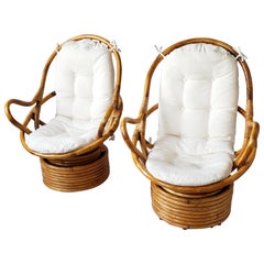 1980s Pair of Rattan Rocking and Swivel Lounge Chair , USA