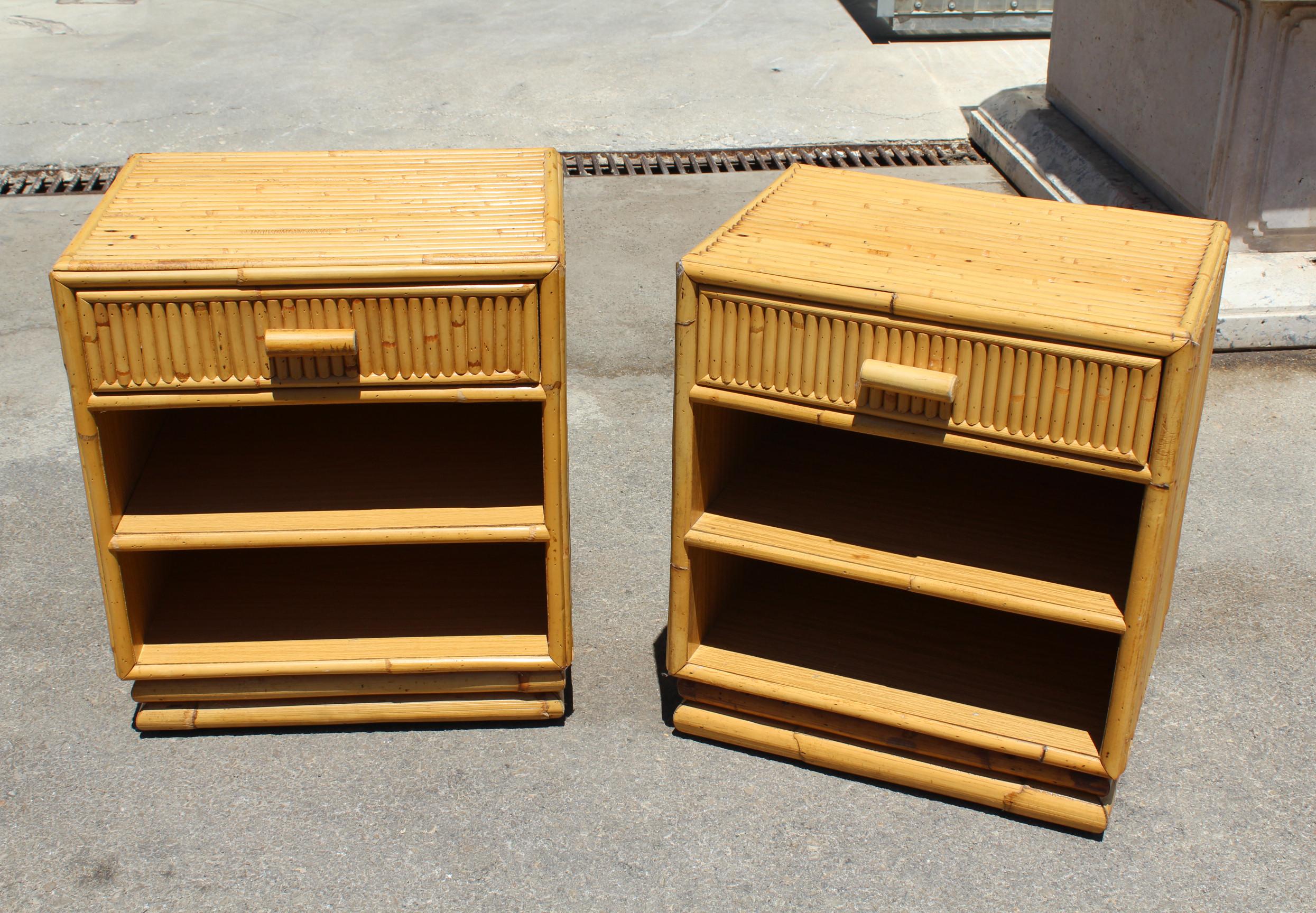 1980s pair of Spanish bamboo and rattan bedside tables, with one drawer and two shelves each.
 