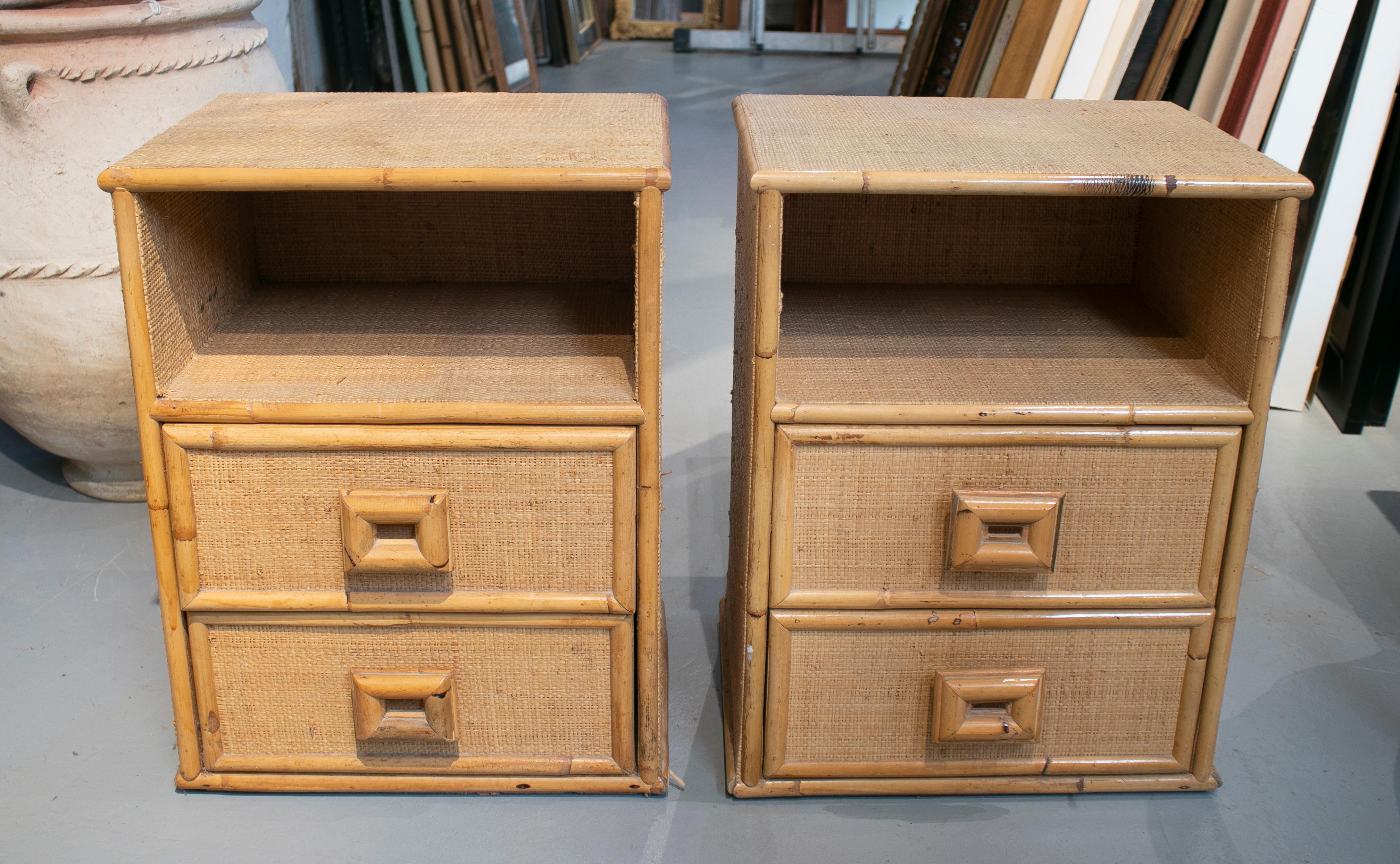 1980s pair of Spanish bamboo and wicker bedside tables.