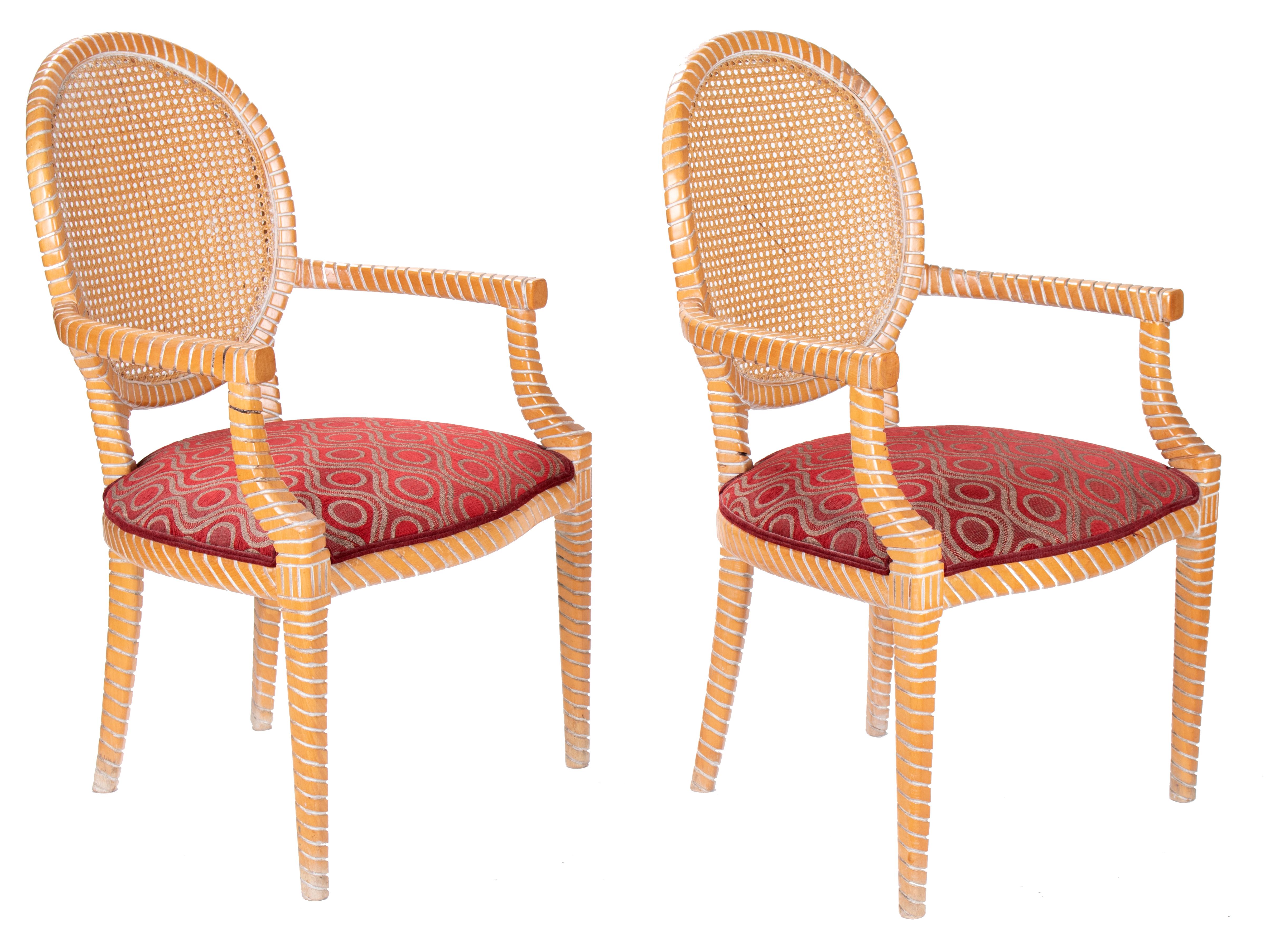 1980s pair of Spanish hand carved armchairs with wicker decorated backrest.
