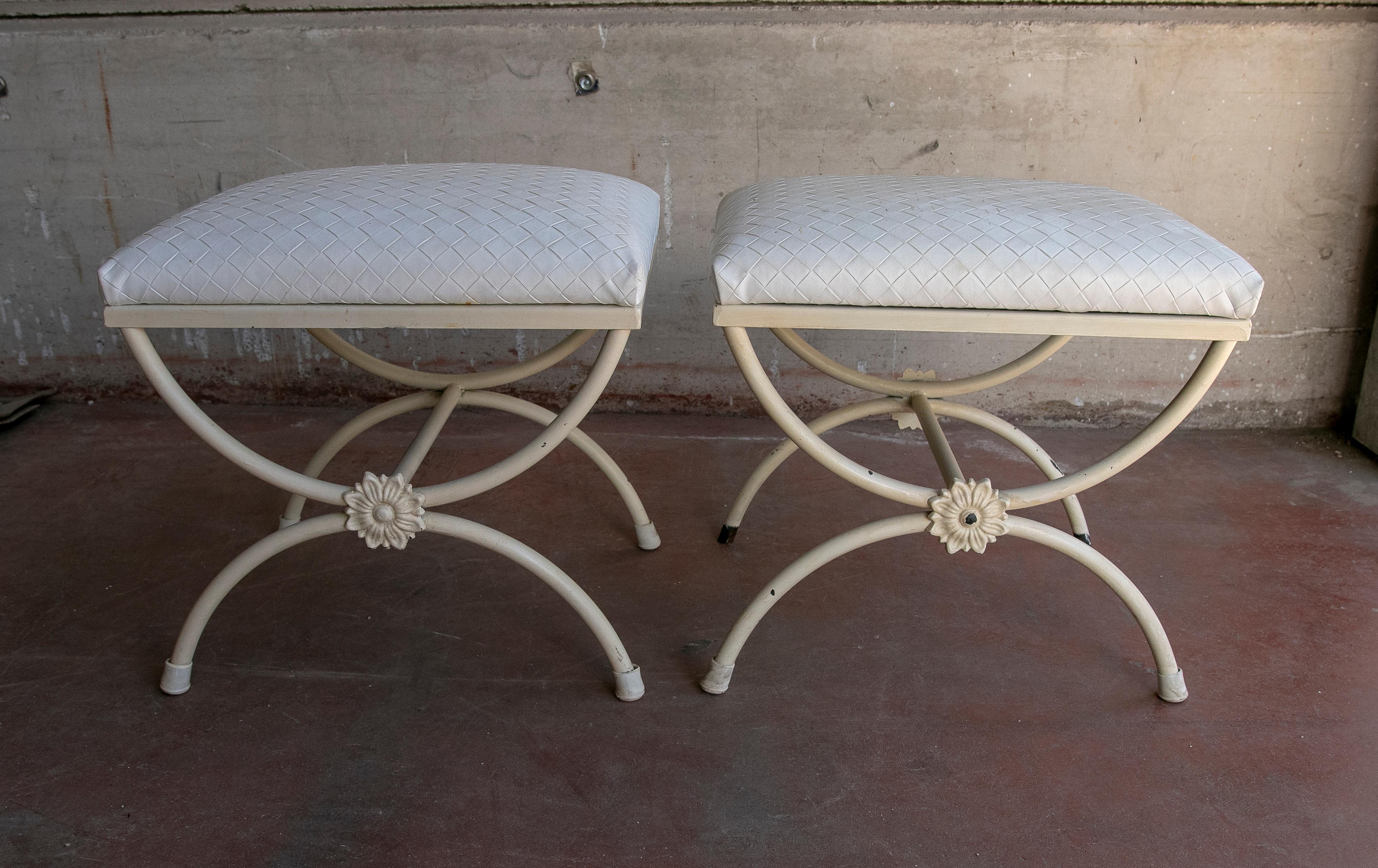 1980s Pair of white painted iron armchairs.