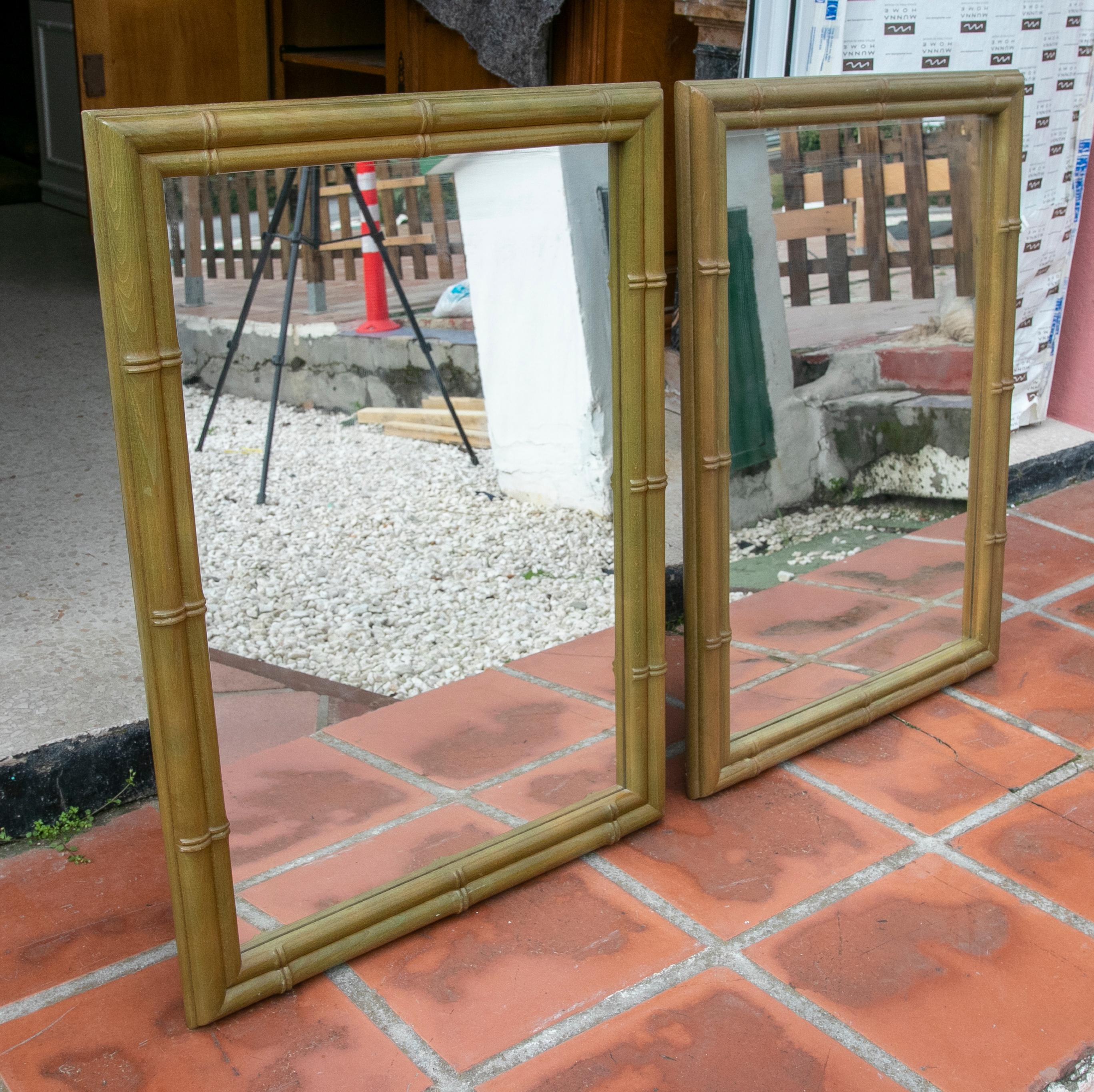 1980s pair of wooden wall mirrors in green colour imitating bamboo.