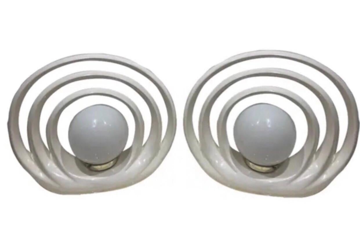 Pair of 1980s Vintage Art Deco Postmodern White Ceramic Halo  Roger Rougier Style Ellipse Table Lamps 

Mid Century Modern meets Nuevo Deco. 

These ceramic ellipse shape table lamps are   beams with elegance. Simple, yet rich. Light glows from the