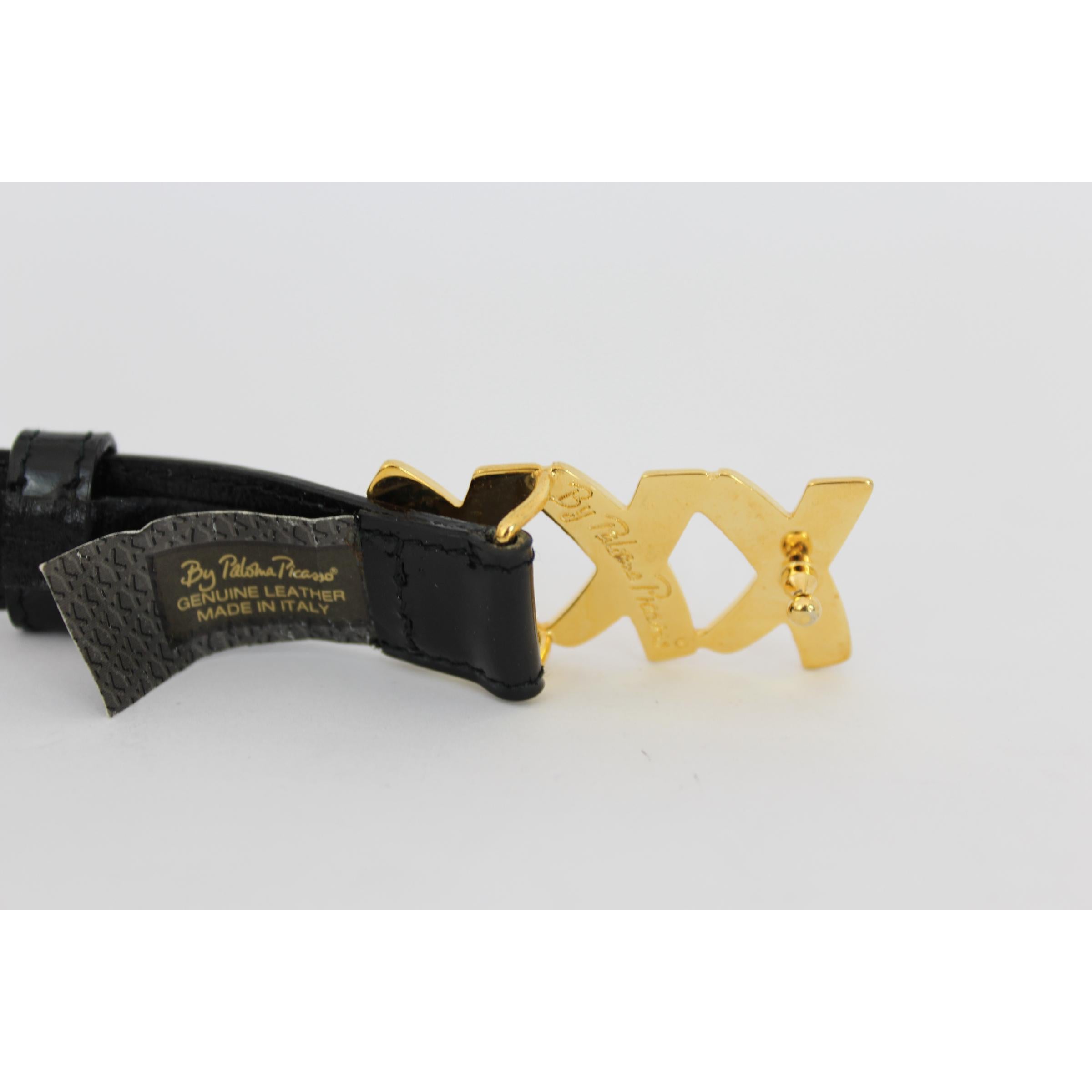 Paloma Picasso vintage women's belt. Black color, 100% calfskin. Triple X buckle, gold color. There are three adjustable notches. 80s. Made in Italy. Certificate N. BL 0861673. New without tag.

Measures: SM / 70 It 26 Us 6 Uk

Length: 80 cm
Width: