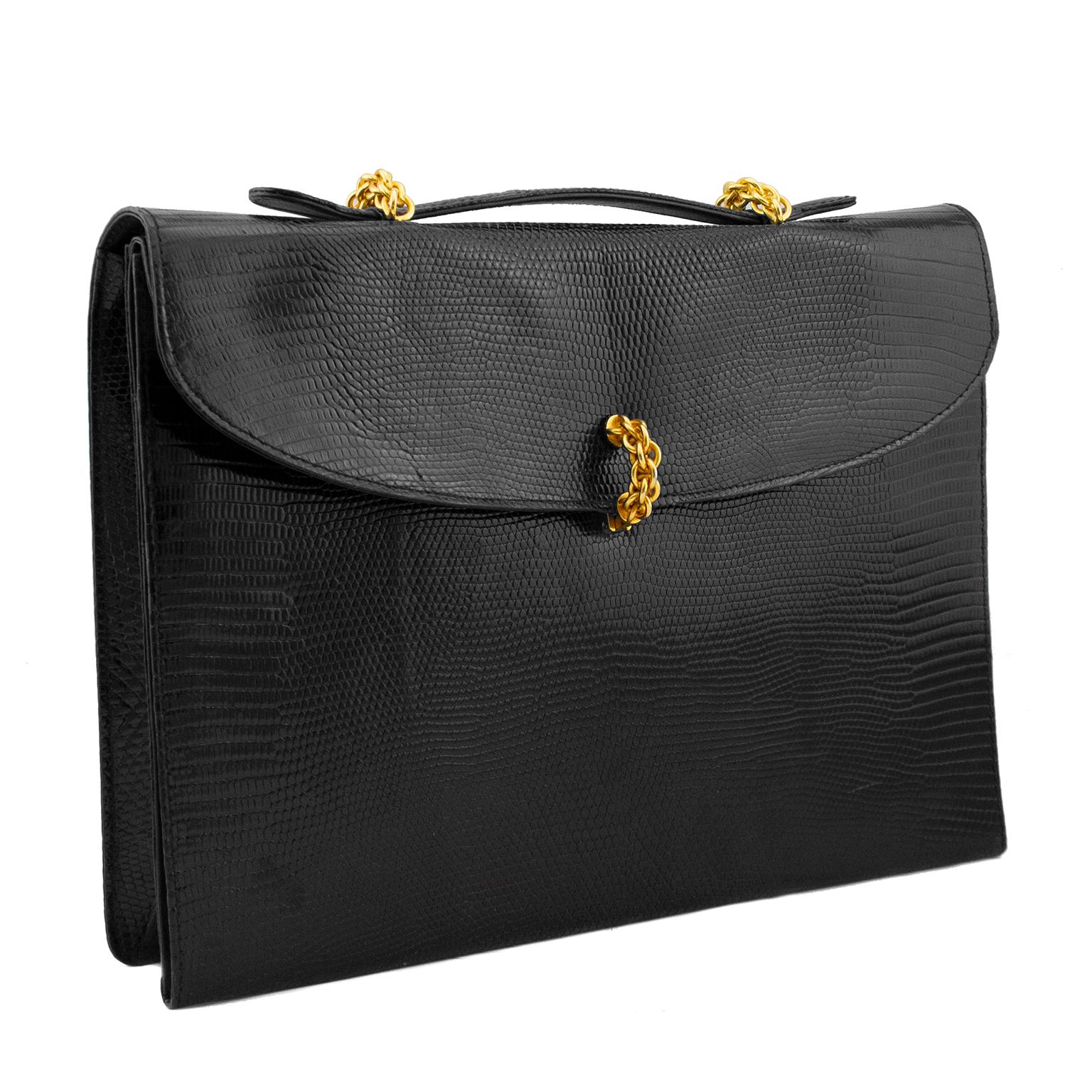 Absolutely stunning 1980s Paloma Picasso top handle black patterned leather briefcase. Gold tone chain clasp and details on handles. Opens flat with supple leather interior and many pockets for documents and cards. A smaller iPad will fit in