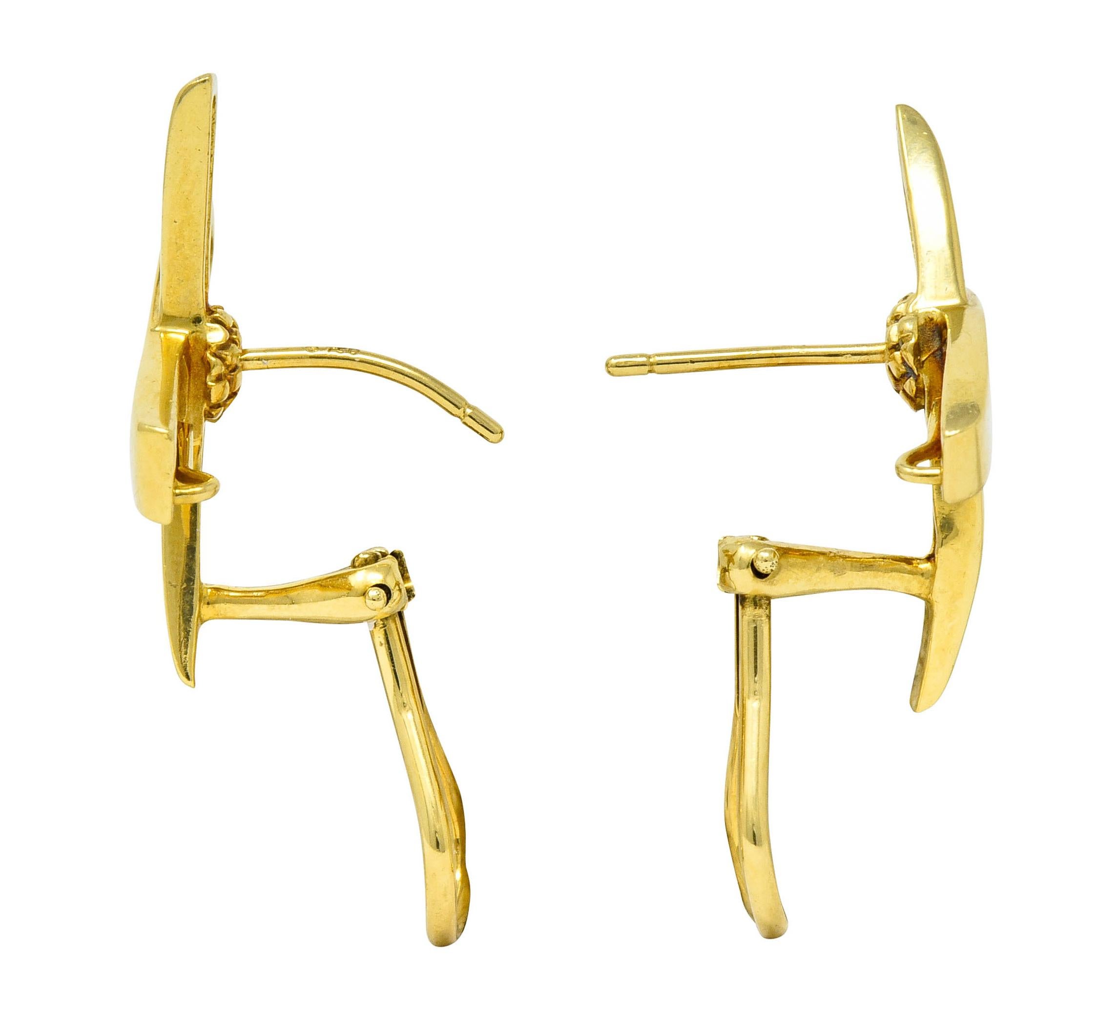 Designed as a sweeping and stylized 'X'

With a bright finish

Completed by posts and hinged omega backs

Fully signed Paloma Picasso Tiffany & Co.

Stamped 750 for 18 karat gold

From the iconic 1980's Graffiti collection

Measures: 5/8 x 3/4