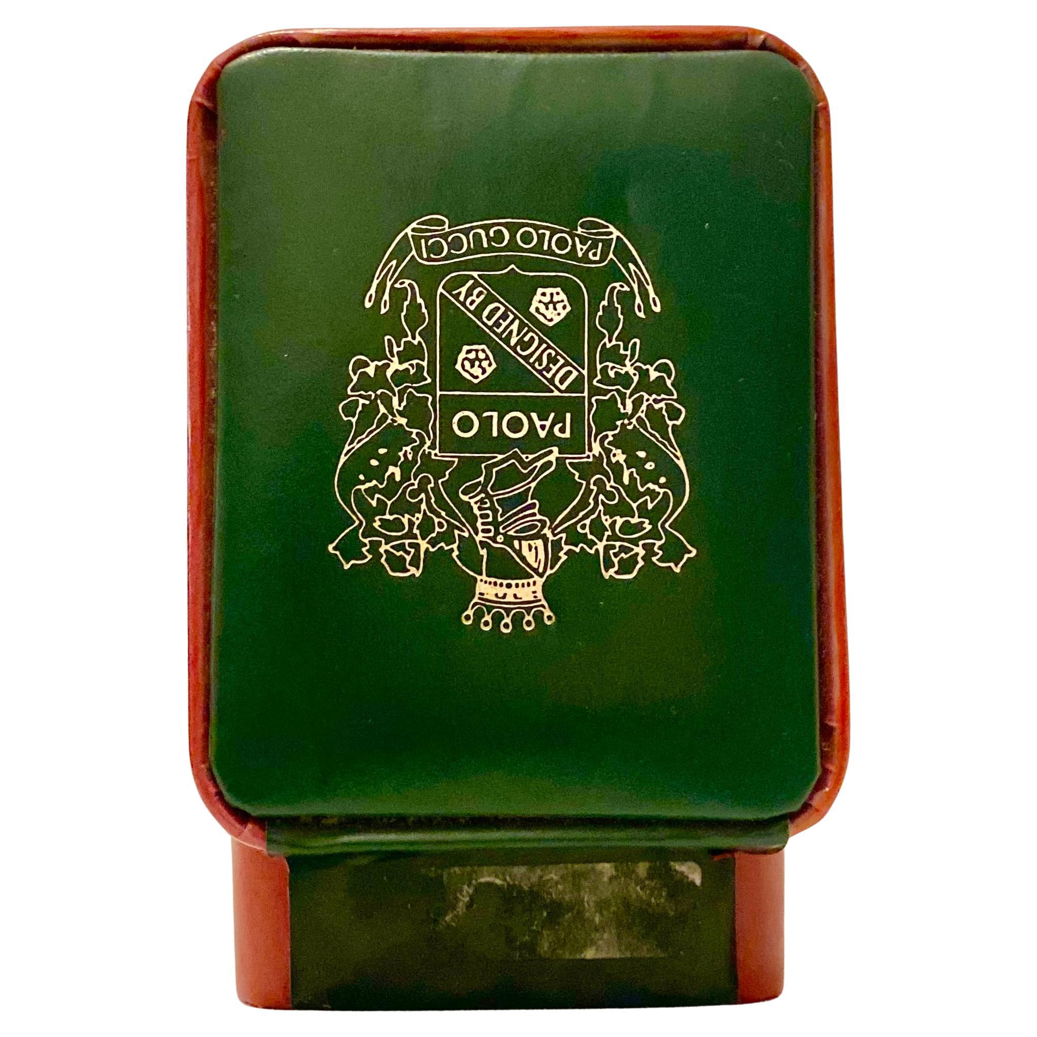 1980s Paolo Gucci Leather Jewelry Box, green ns red soft leather, logo printed on top in silver ink, new replaced black pillow. 

Condition: 1980s, very good, slight sign of use 

Dimensions: 10x8x6vm / 4x3.5x2.5in 