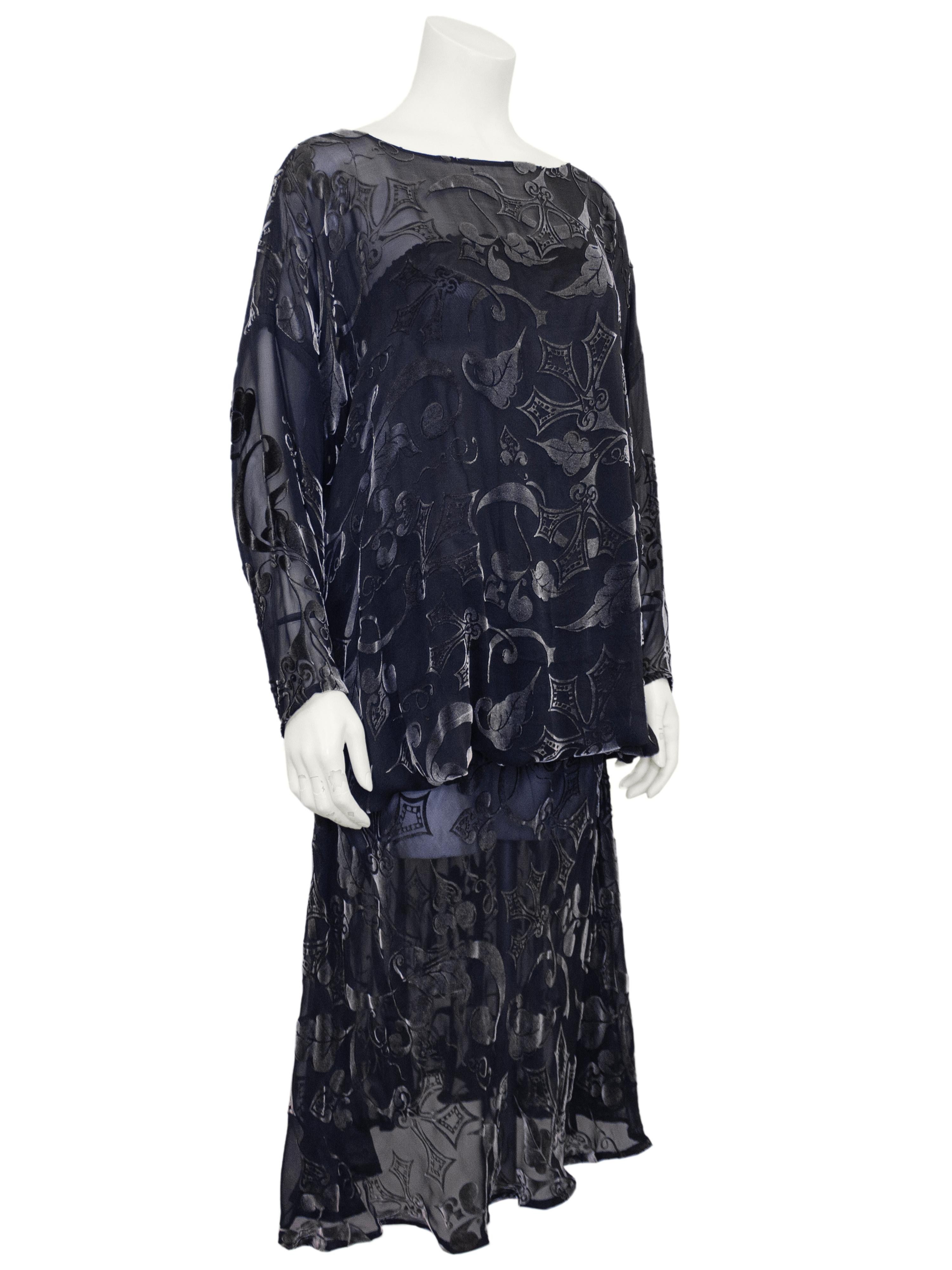 1980s Patricia and Charles Lester drop waist evening dress. Gunmetal devoree velvet with a medieval leaf print throughout. The bateau neckline balances the drop shoulders, Dolman sleeves and an elasticized blouson drop waist skirt. The full length