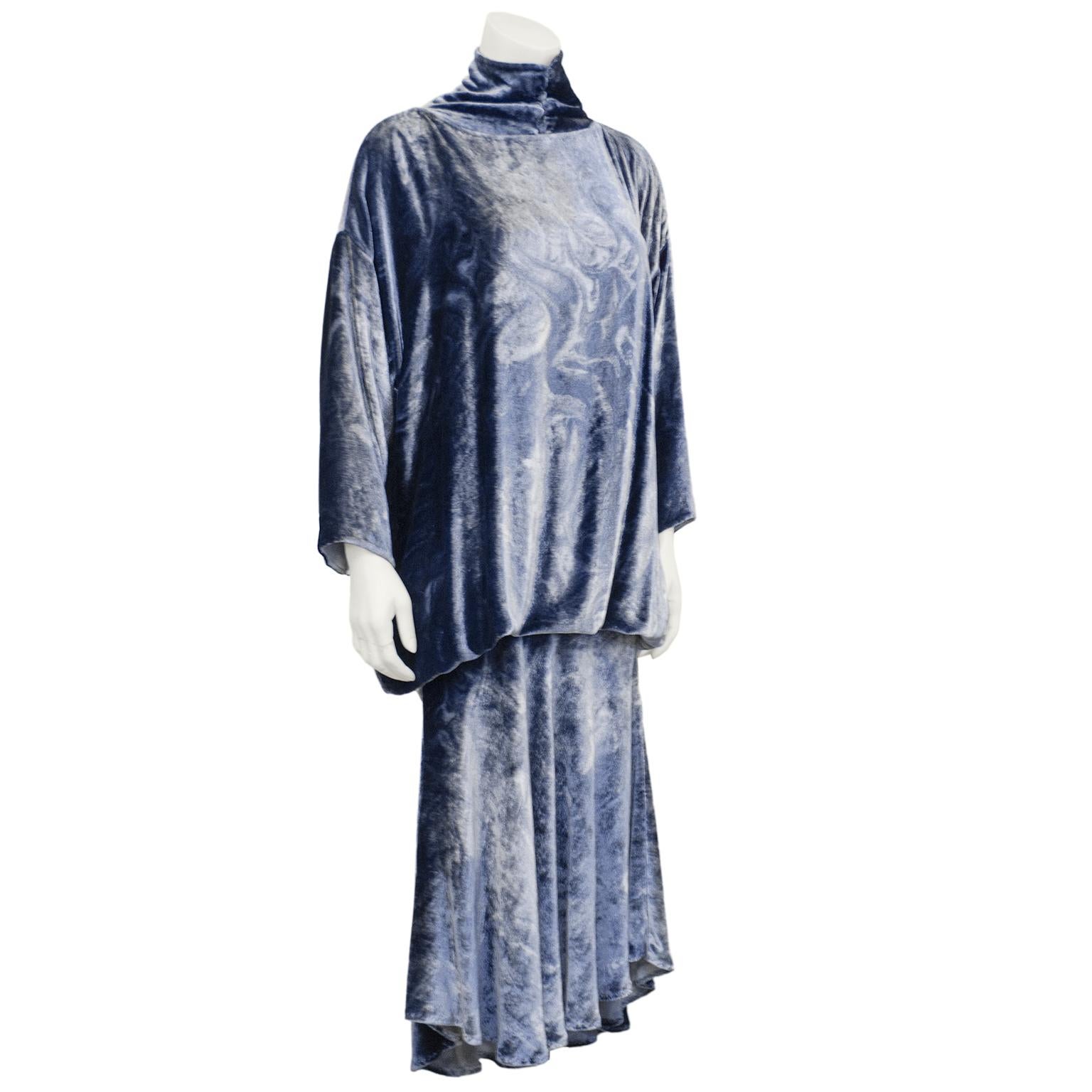 1980s Patricia Lester ensemble. Blue panné velvet  pressed to create a white swirl throughout. Top features a cowl neck with buttons, drop shoulders, Dolman sleeves and a blouson hem. Skirt sits at the waist with an asymmetrical hem. Excellent