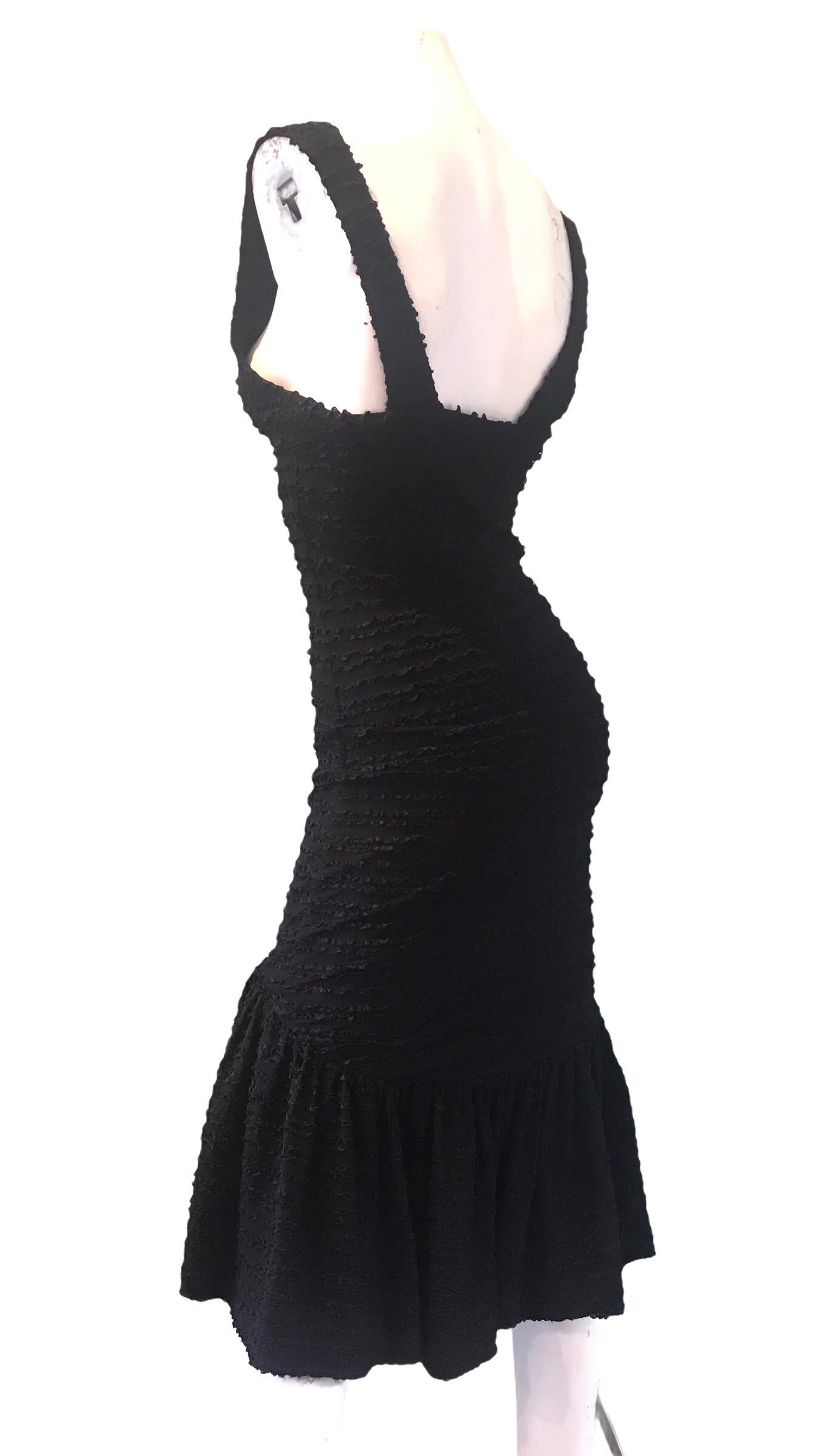 1980s Patrick Kelly black dress with stretch. Condition: Excellent
Size M

27