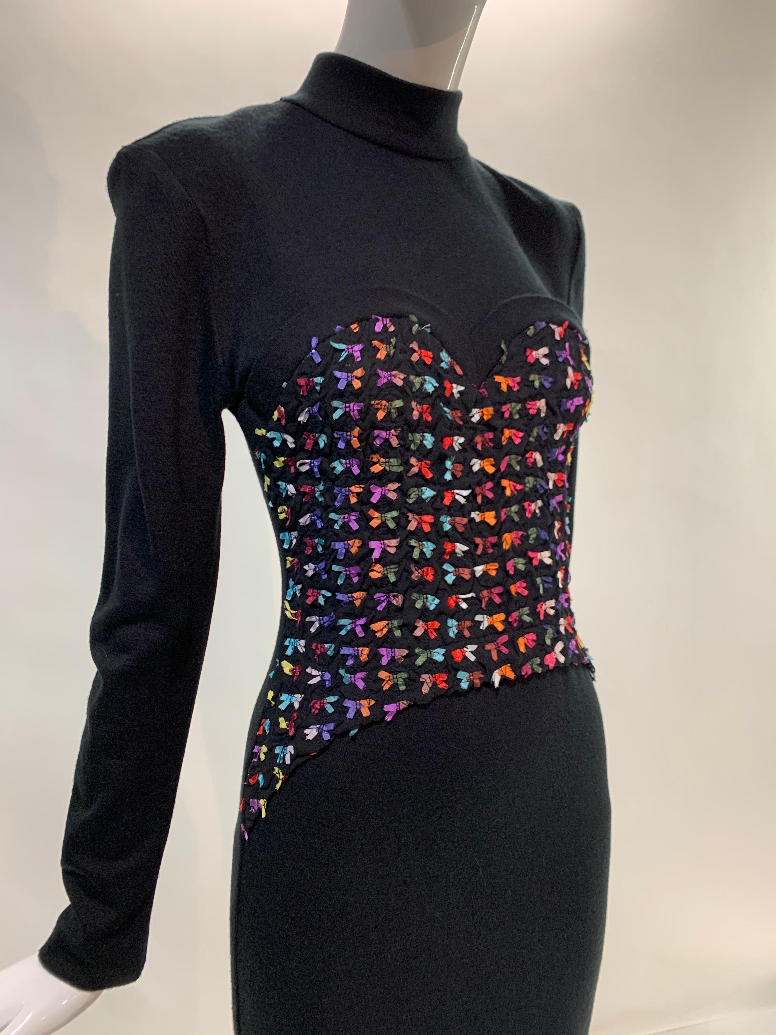 A rare 1980s Patrick Kelly black wool jersey dress with long sleeves and a genius trompe l'oeil corset delineated by tiny rainbow colored ribbon bows!  So witty! Size 4-6.