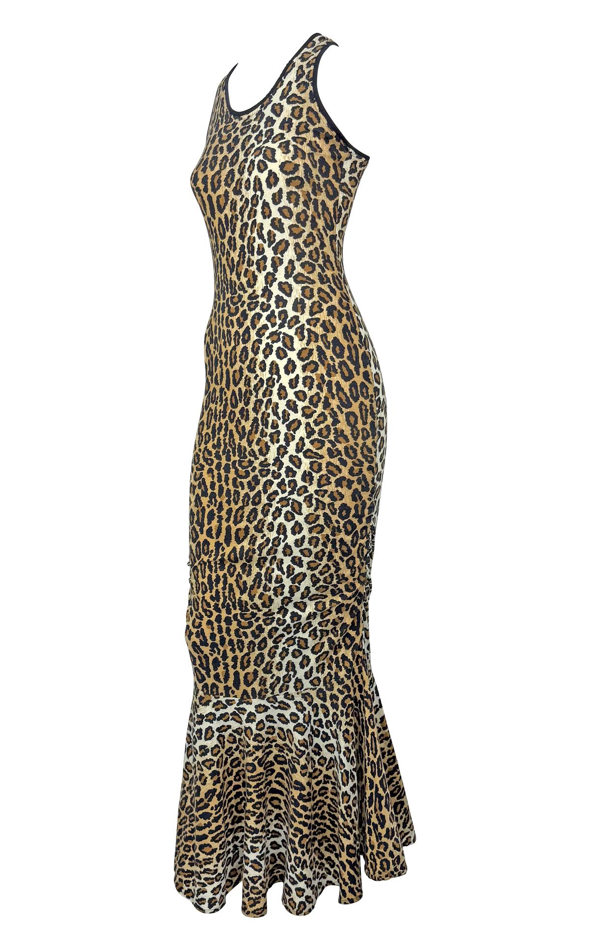 From the visionary Patrick Kelly, this 1980s leopard-print gown captures the designer's love for statement prints. Crafted from stretch cotton jersey, the figure-hugging silhouette features a racerback cut, accented with a black trim. The bottom of