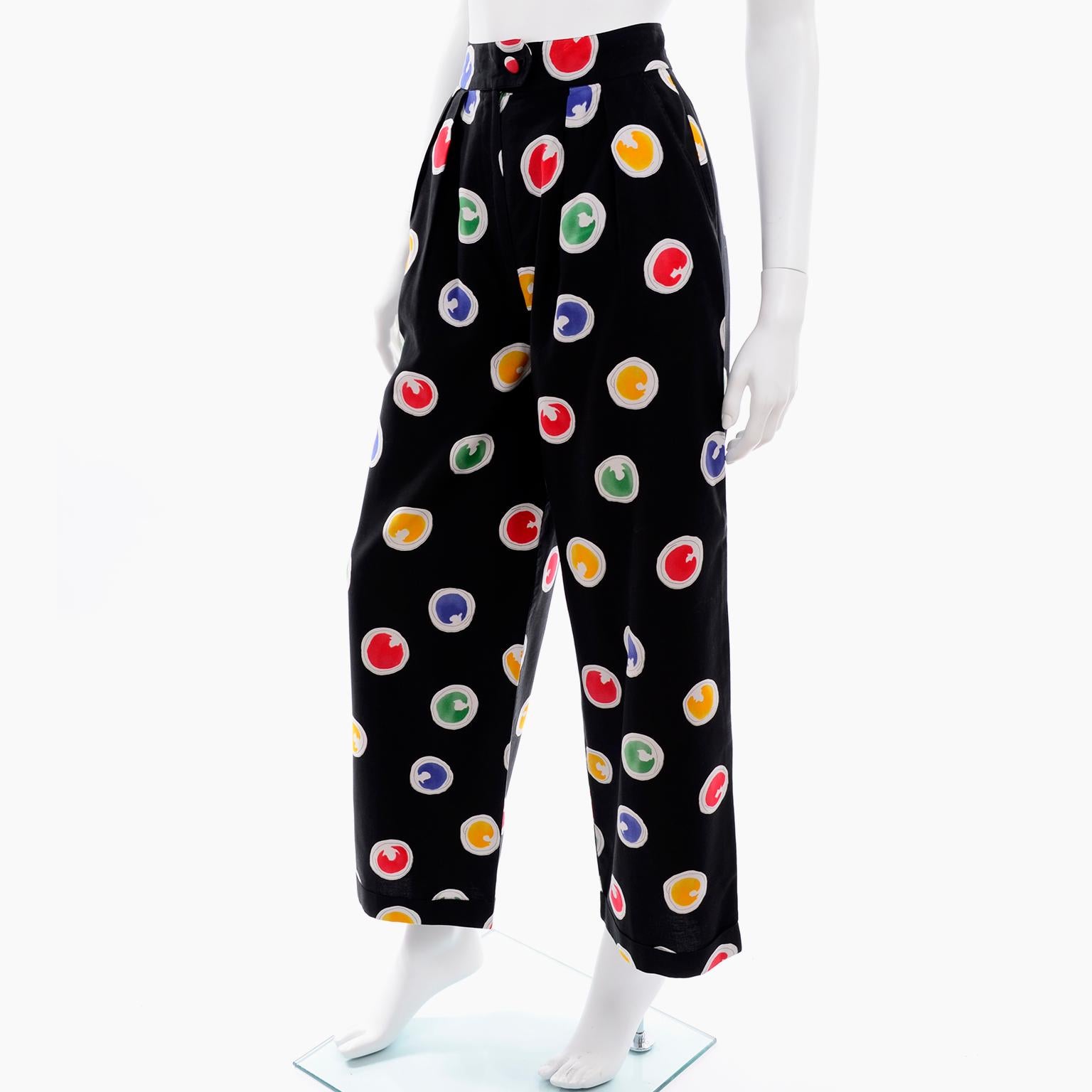 These vintage black cotton high waisted pants were designed by Patrick Kelly in the 1980's. We love Patrick Kelly and treasure his designs whenever we are fortunate enough to find them. These trousers are in a circles print that is meant to resemble
