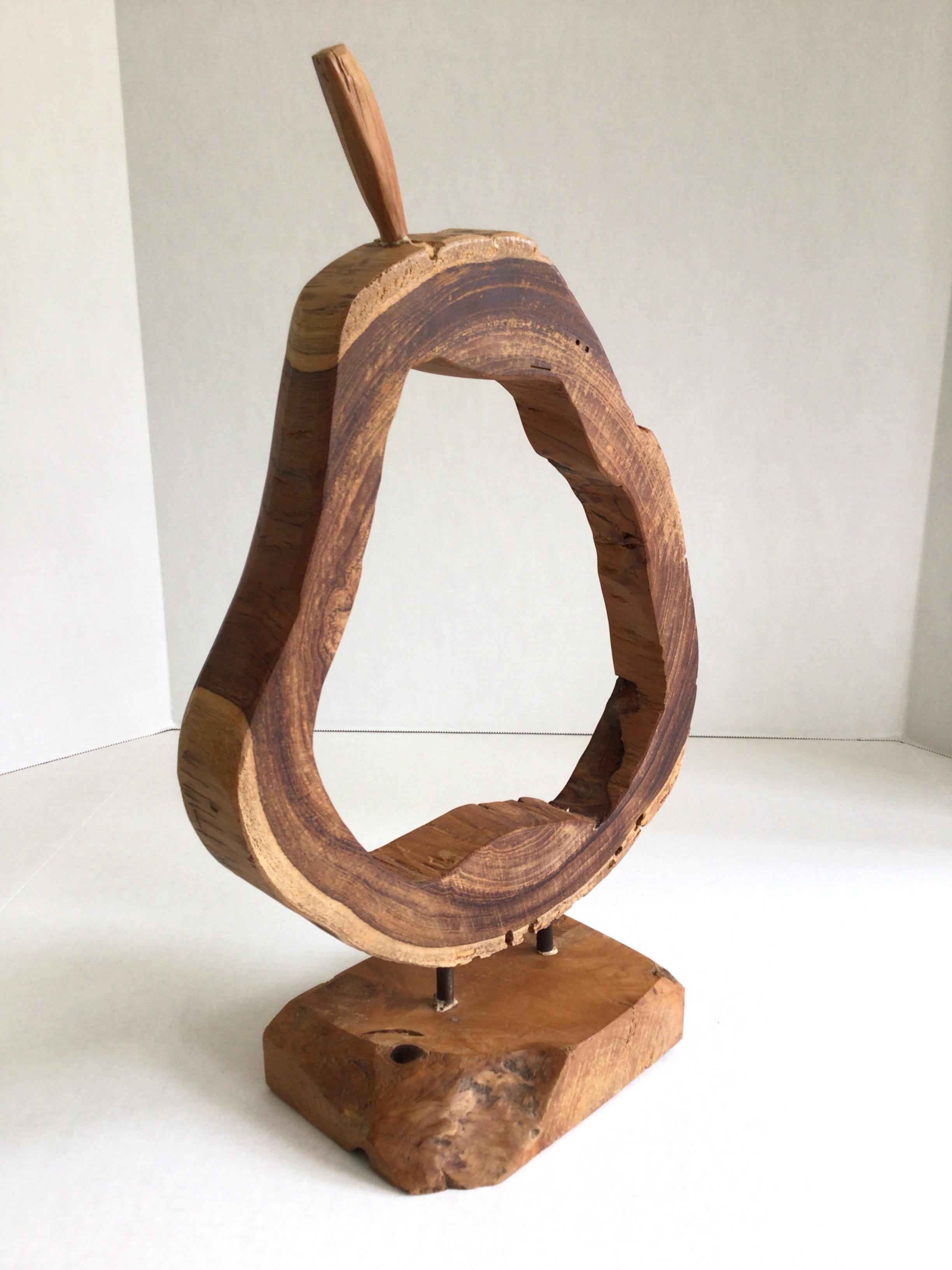 1980s Pear Shaped Mounted Wood Object on Wood Base
or an Apple or other fruit with stem
Metal Rods mount to a Rough Hewn Base
Cut slit in base (as shown in pictures)
Perfect decorative accessory for a kitchen, coffee or ice cream shop 
Natural and