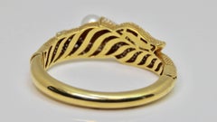 1980s Pearl and Diamond Hinged 18 Karat Yellow Gold Bangle Bracelet