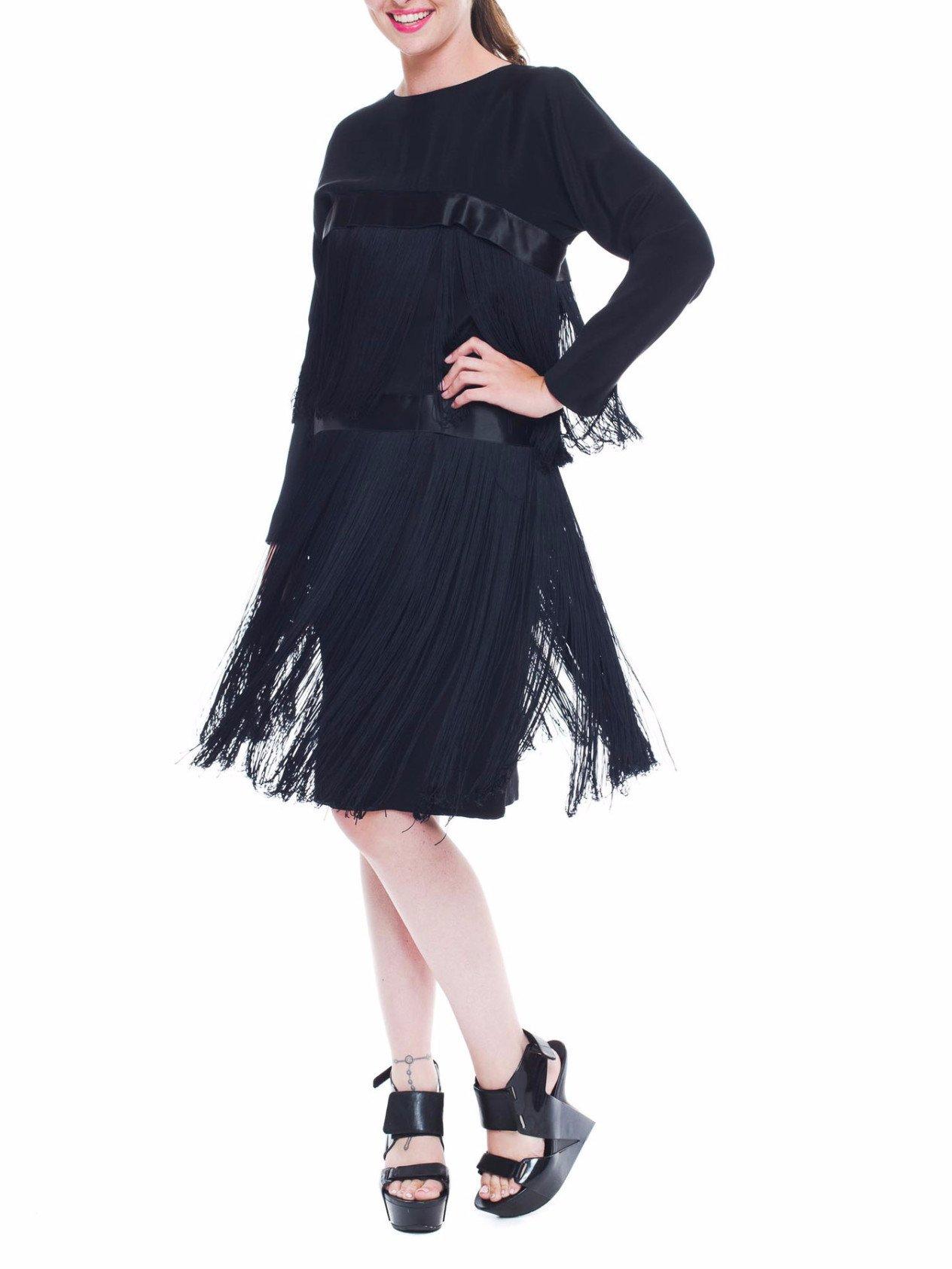 Demi Couture construction with an internal boned corset and waist stays. Very high quality silk and rare extra long fringe.  1980S PETER KEPPLER Black Silk Faille Long Sleeve Fringed Cocktail Dress 
