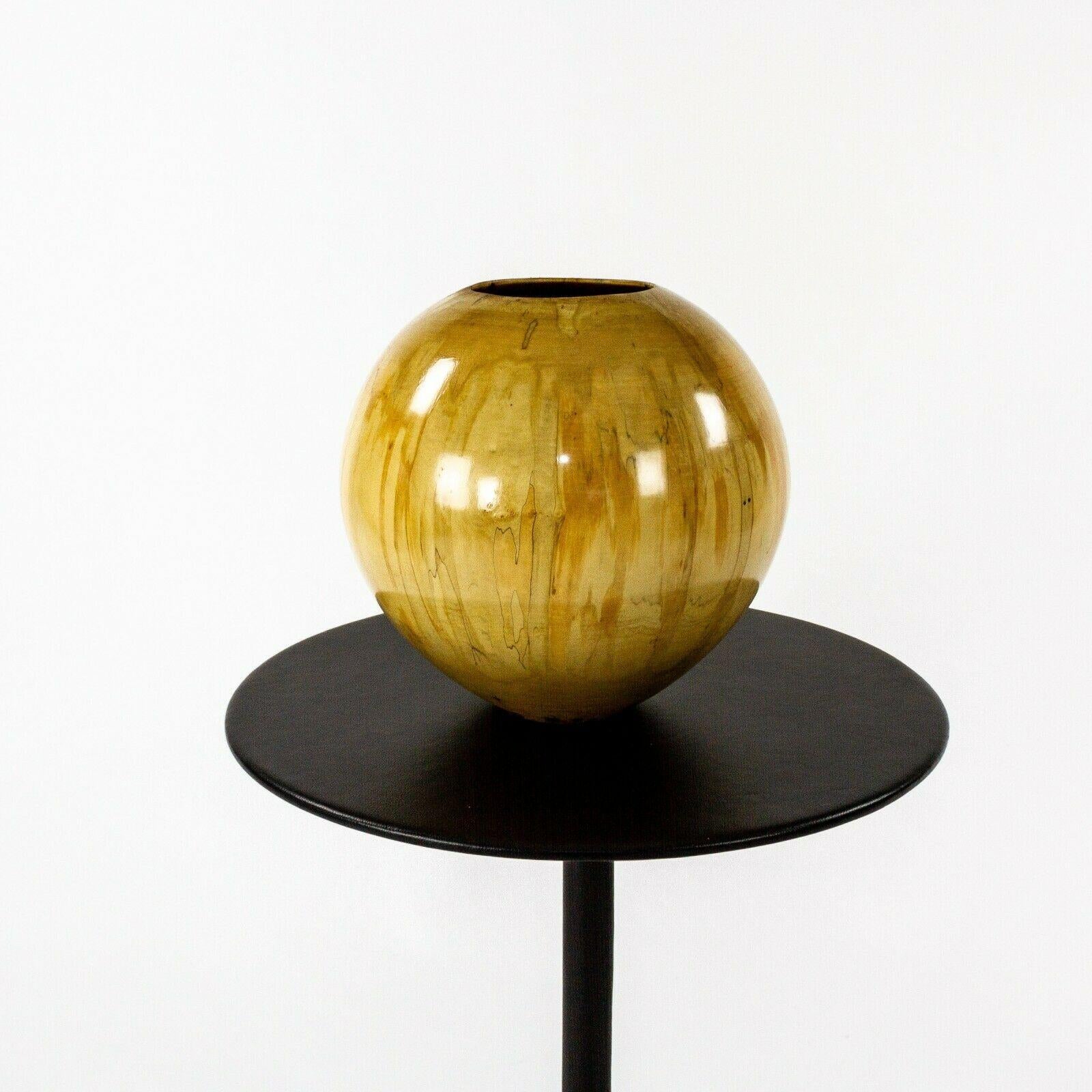 Listed for sale is a gorgeous ash leaf maple (also known as acer negundo) spherical turned wood bowl with high gloss finish, produced by renowned woodworker Philip Moulthrop. The piece came from a Pittsburgh, Pennsylvania estate along with a number