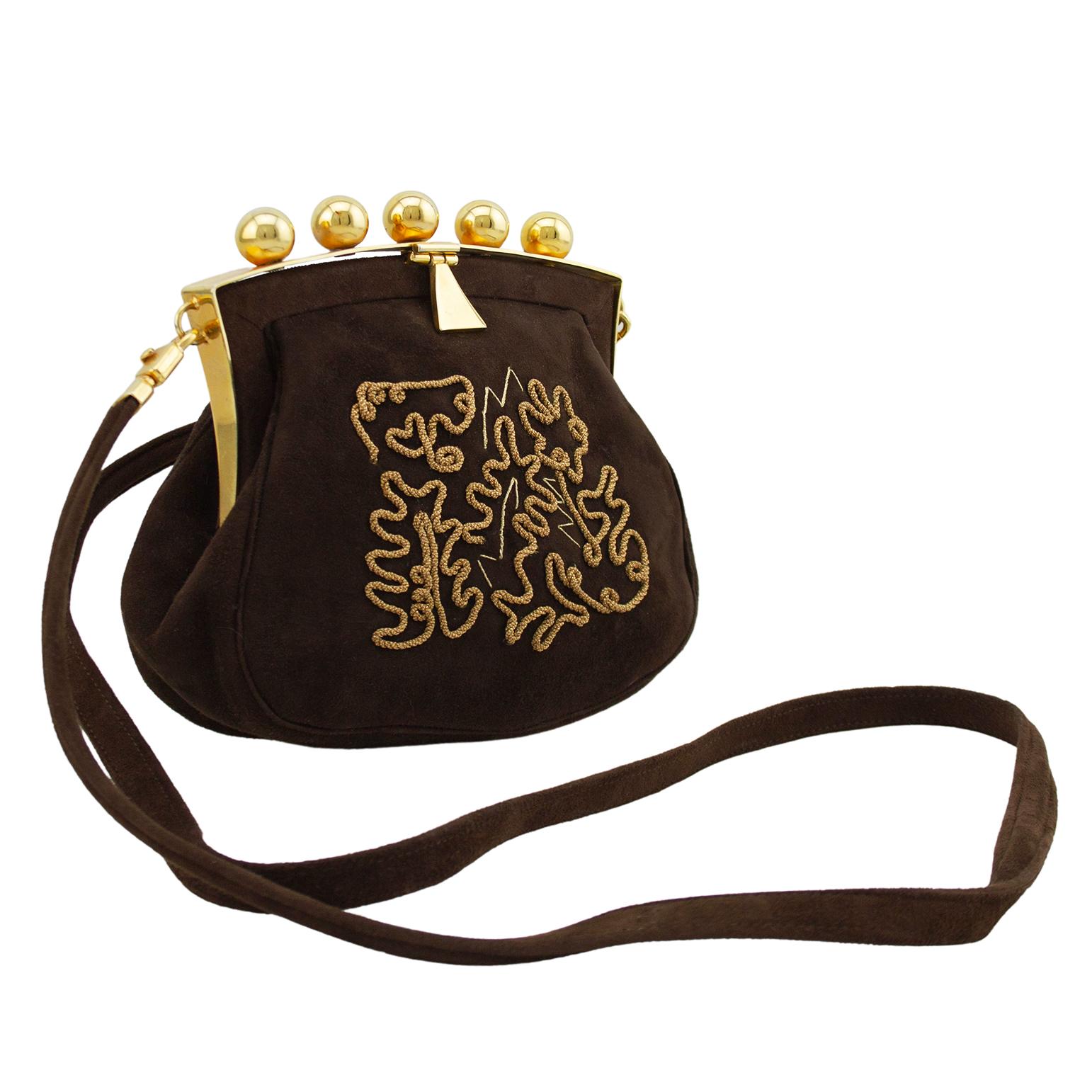 Very unique and interesting Phillippe Model frame style bag from the 1980s. The bag is small, but packed with so much intricate detail. Dark brown suede with abstract twisted gold rope and gold thread embroidery on the front. The top features