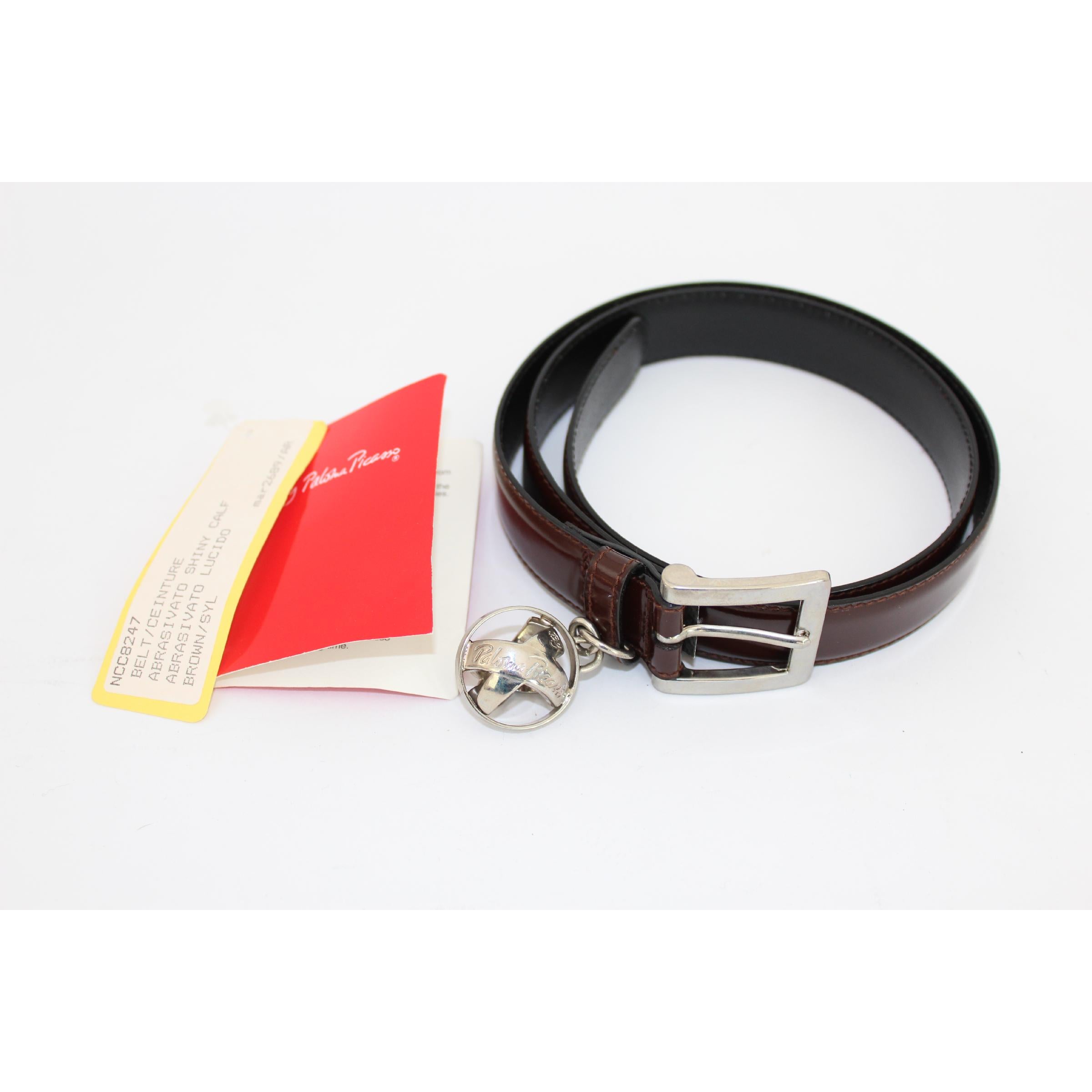 Picasso Paloma vintage women's belt, Tiffany designer, brown, 100% shiny leather, buckle with silver pendant, three adjustable notches. 80s. Made in Italy. New with tag. Certificate No. BL 0863523

Size: 75 / MD It 28 Us 8 Uk

Length: 85 cm
Width: 2