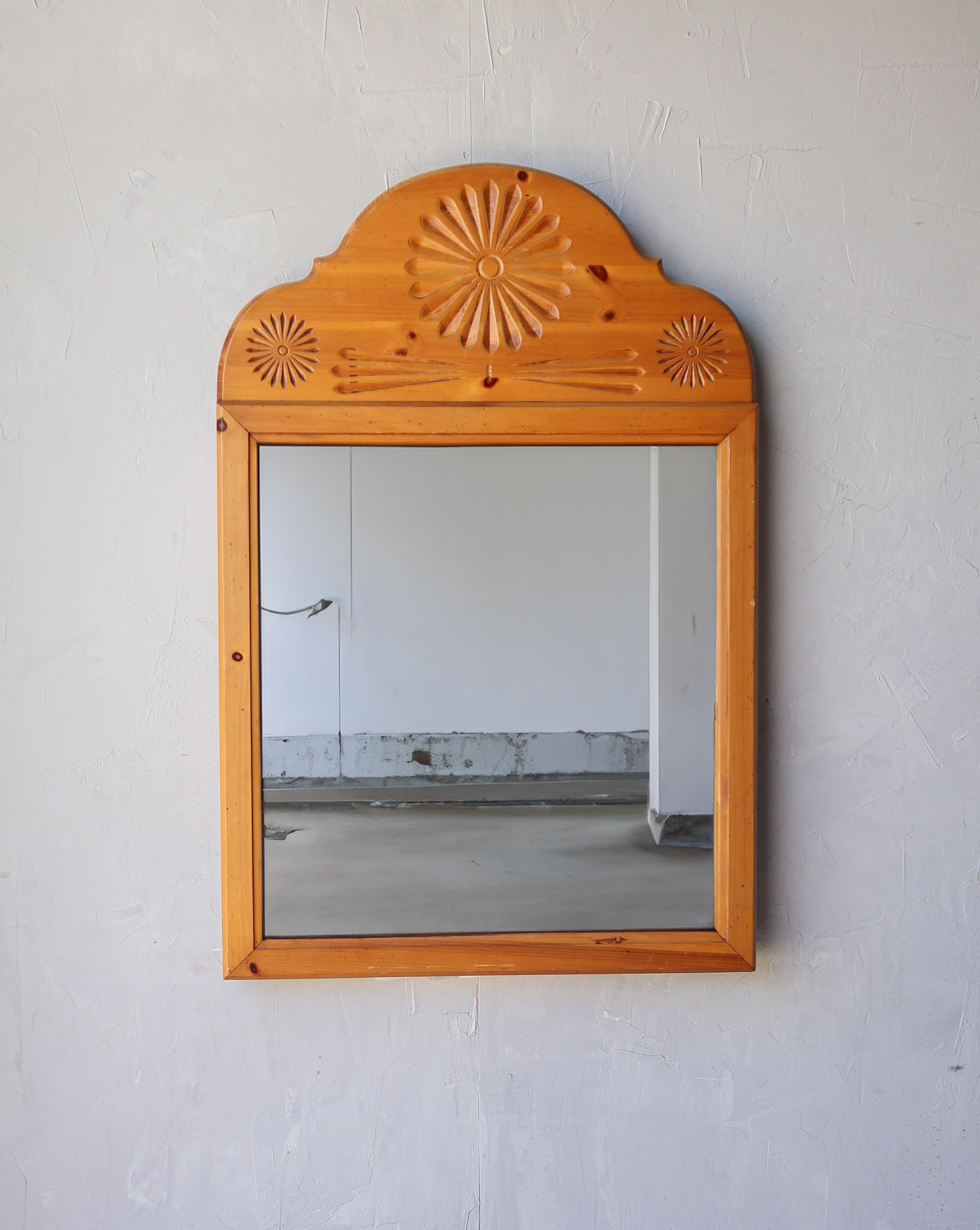 Nice solid pine wall mirror with hand carved decorative detail.

Excellent condition, only minimal signs of age and use, no actual15 imperfections to be noted.