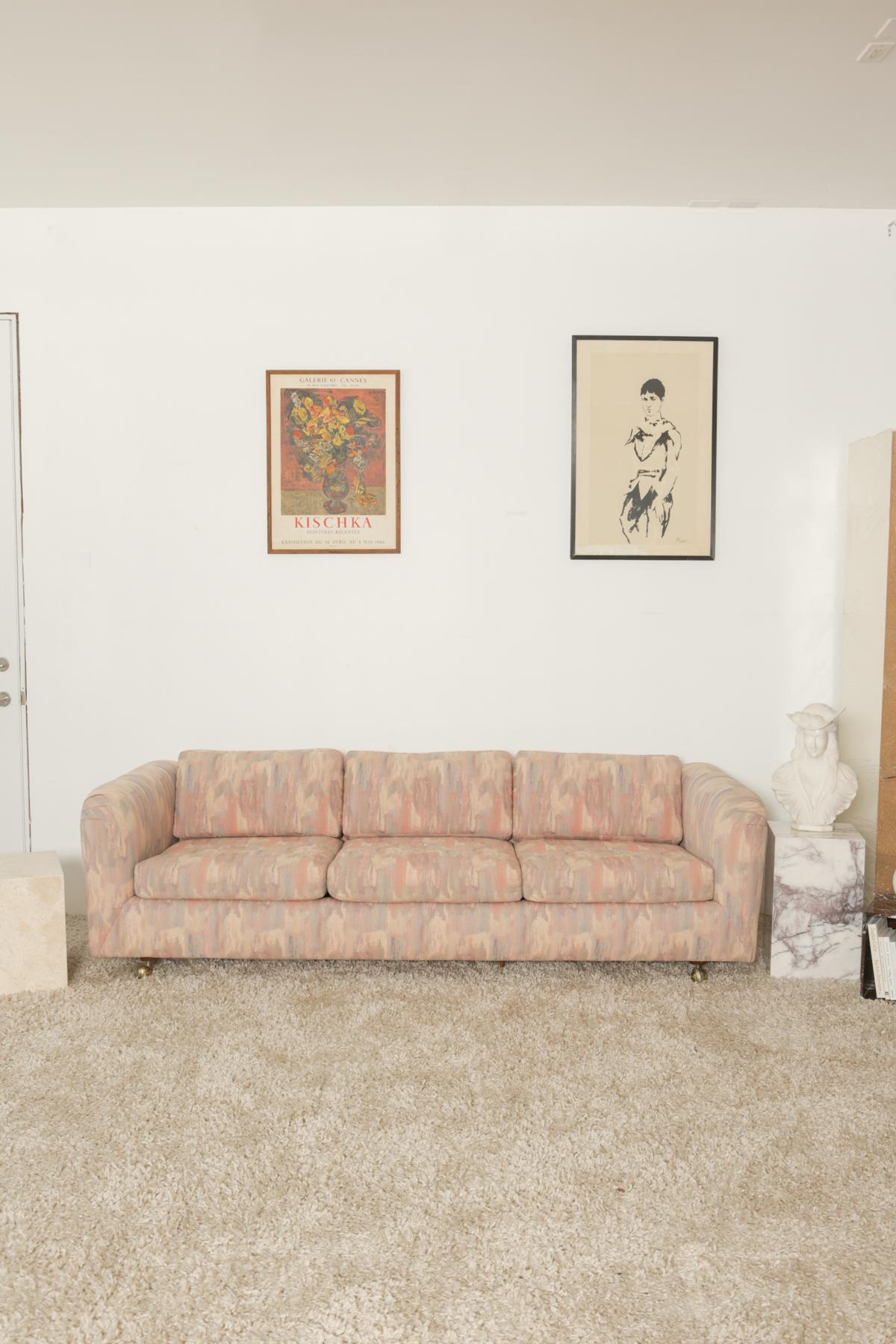 This will be your ultimate recharging sofa. Binge watch Netflix, read books, hang out with your friends and family, and take a nap on this well cushioned sofa. Multiple pink shades with a hint of sky blue pattern custom made sofa by Bloomingdales.