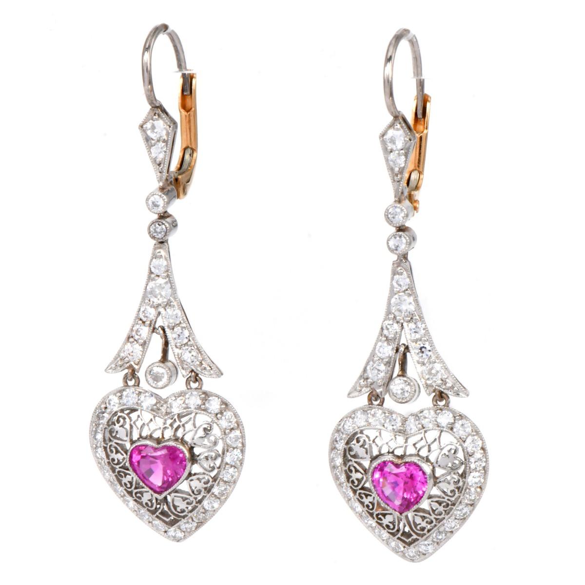 Vintage Pink Sapphire Heart Diamond Drop Earrings

Delicately crafted in platinum and 18K gold, these vintage Deco-style dangle drop earrings feature sweet filigree heart frames set with natural pink sapphires, approximately 1.20 carats