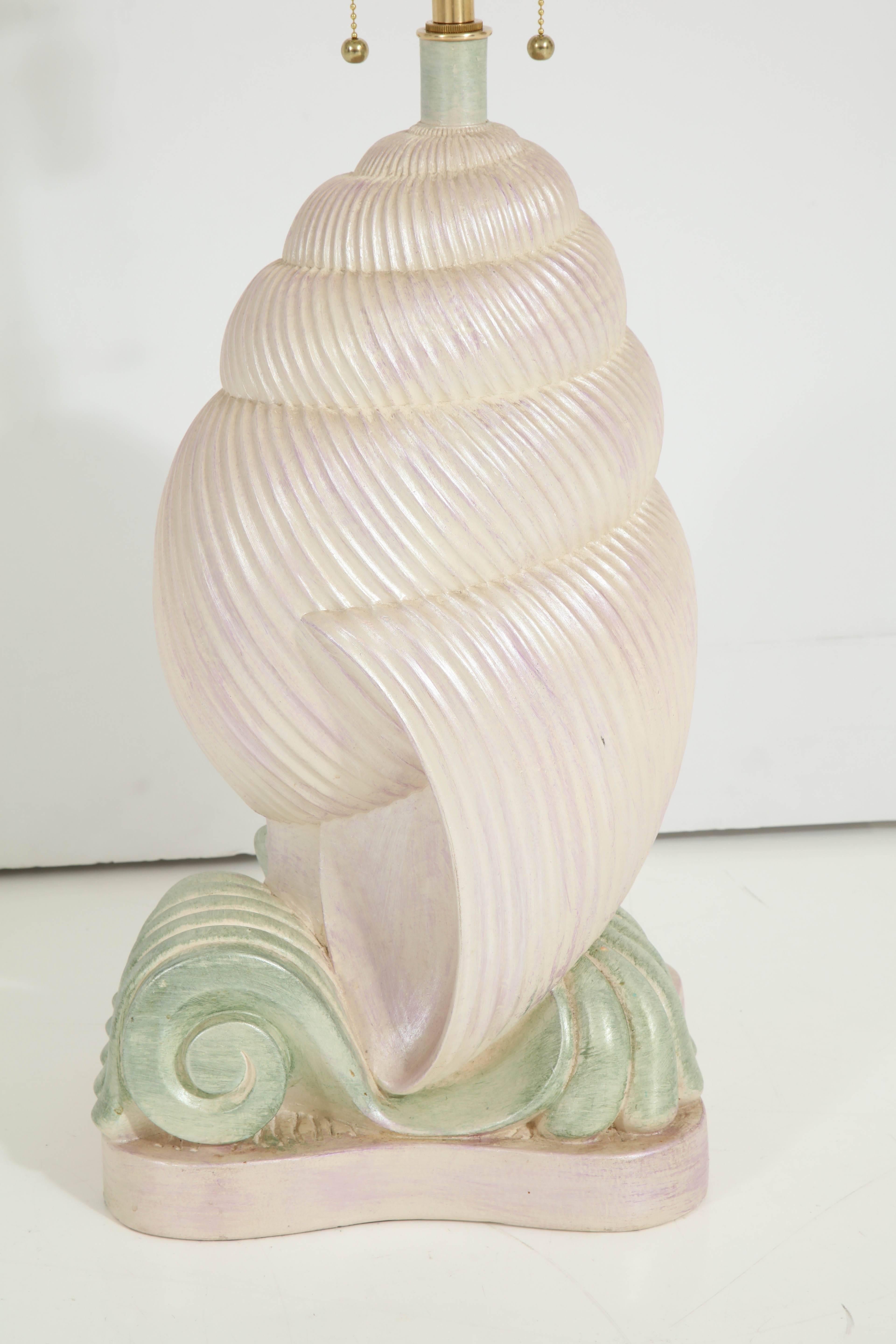 1980s Whimsical plaster conch shell lamp.
The lamp has been newly rewired for the US with a polished brass double cluster that takes standard light bulbs.
Measure: The overall height of the lamp is 32