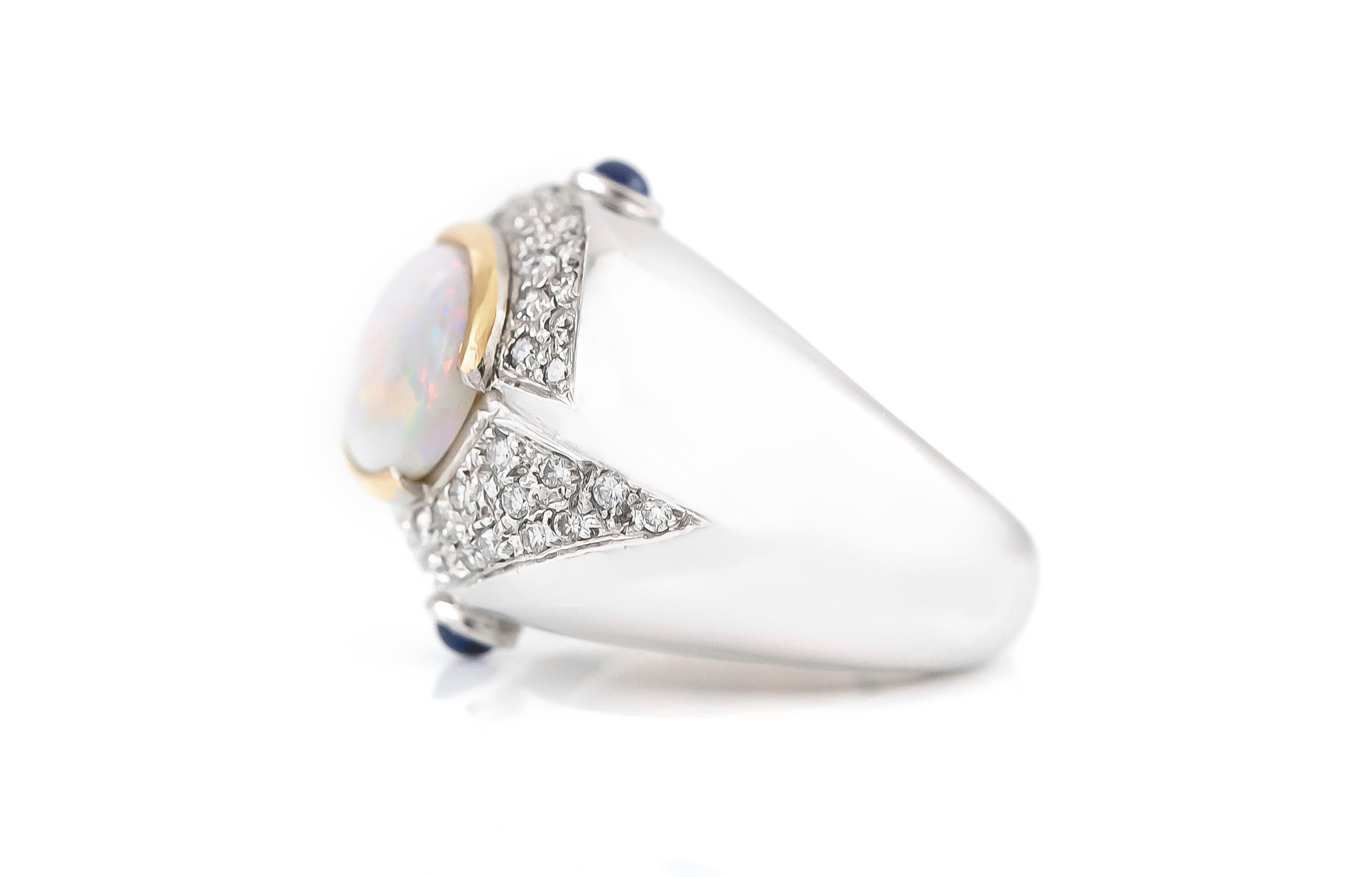 The ring is finely crafted in 18k white gold with canter stone opal and with diamonds that weighing approximately total of 1.00 and sapphire weighing approximately total of 0.20 carat.
The total ring weigh 13.3 DWT.
Circa 1980