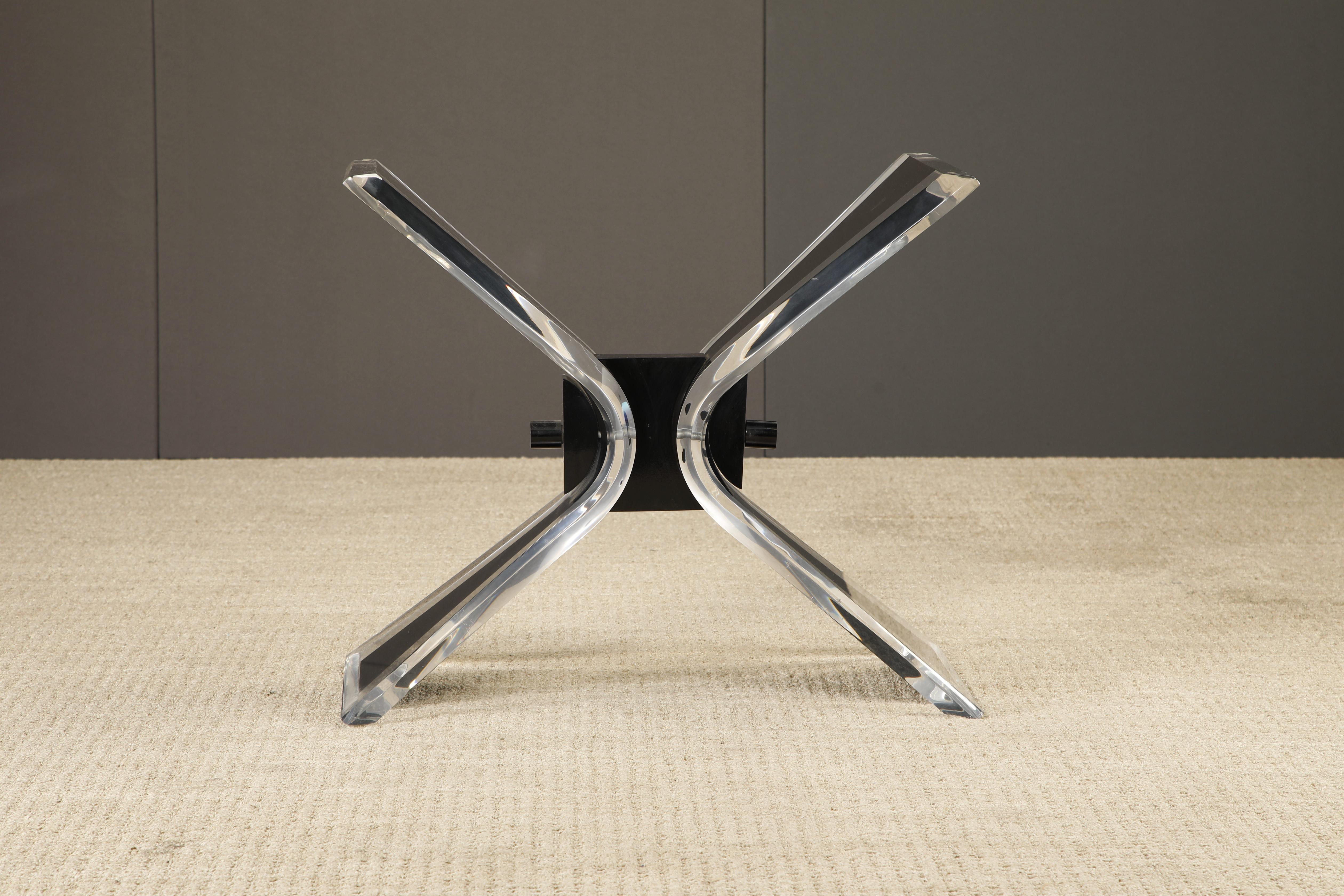 A sleek 1980s Post-Modern lucite dining table base that can also function as a console table base, features thick gleaming lucite with black accents. We have several glass tops that can be included or a new top can be made for this stylish piece.