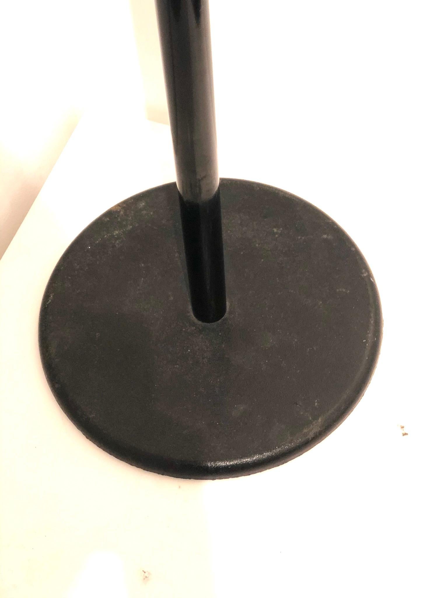 Very cool and simple design on this black metal pole, solid iron base and plastic hooks circa 1980s great condition.