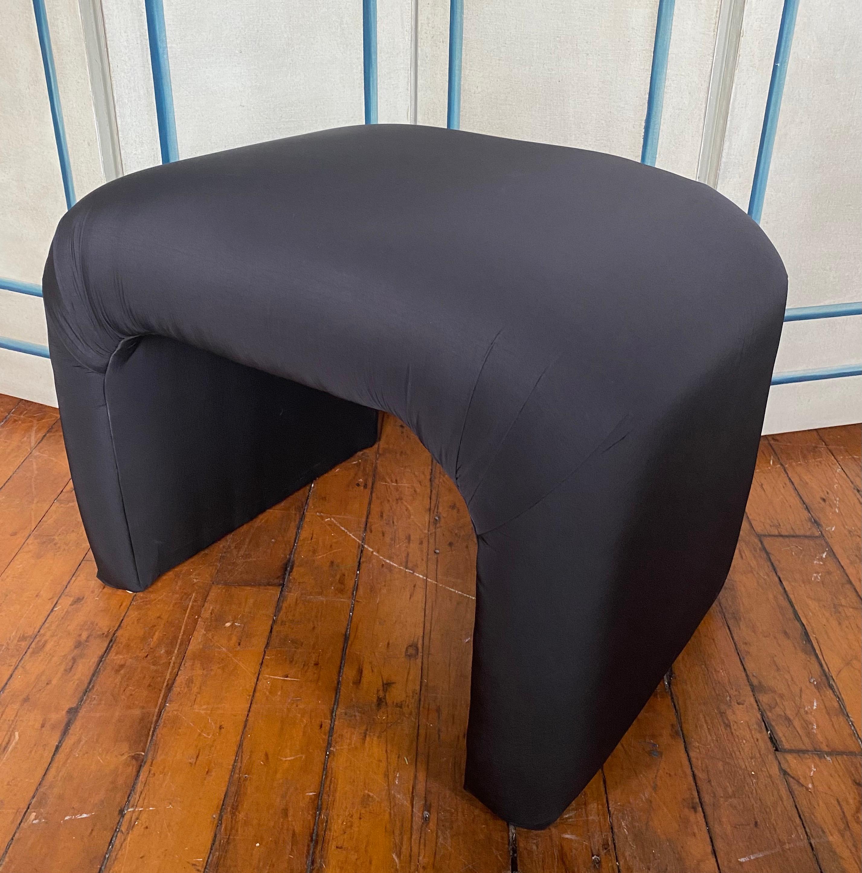 Post modern curved waterfall bench upholstered in a black satin fabric. This sculptural Hollywood Regency style stool is perfect for extra seating. In the style of Karl Springer.

Coordinating chair in same fabric also available and listed