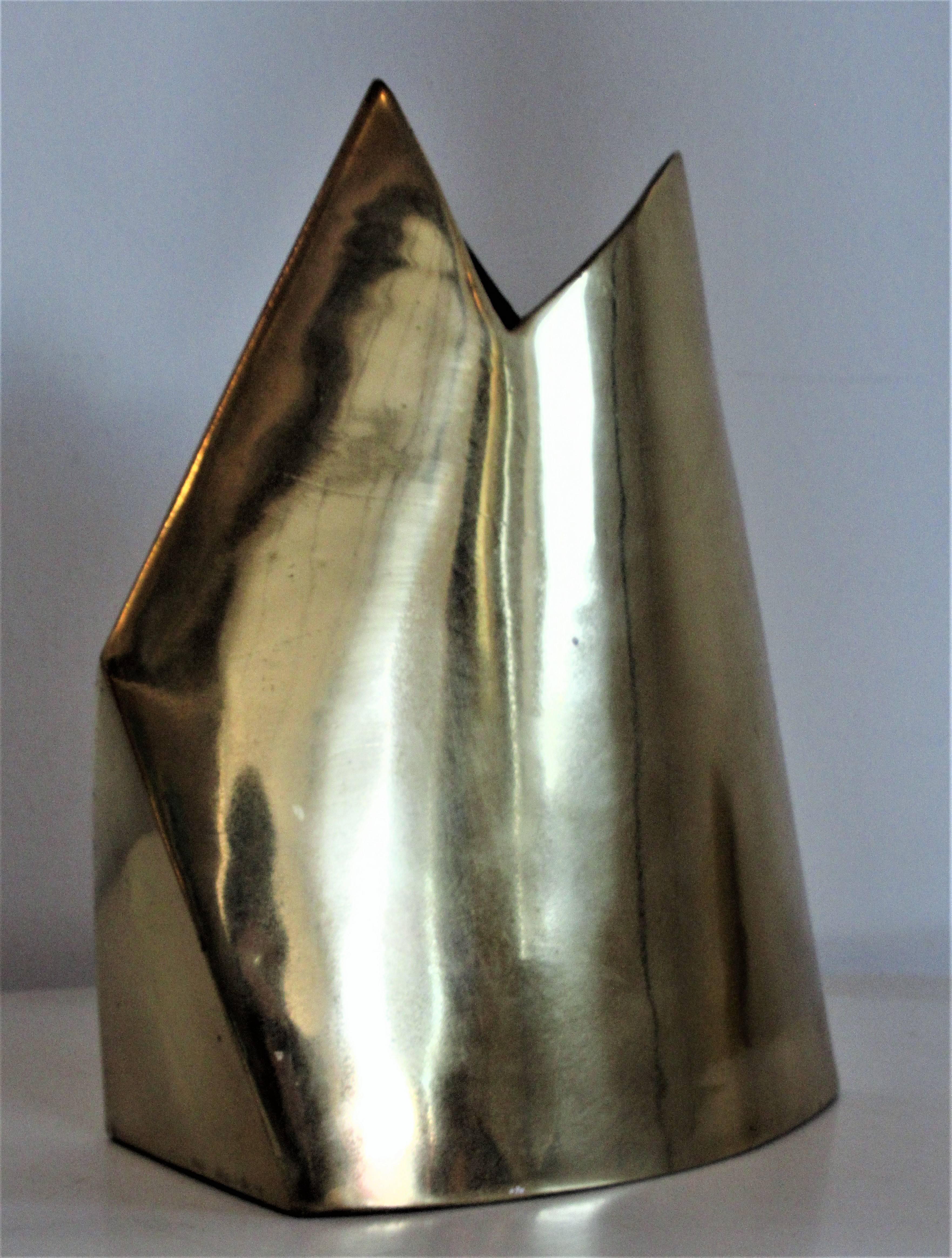 Two complimenting brass vases with a cutting edge sleek architectonic design form by James Johnston, circa 1980. Both are signed on underside, see picture. Small vase measures 9 1/4