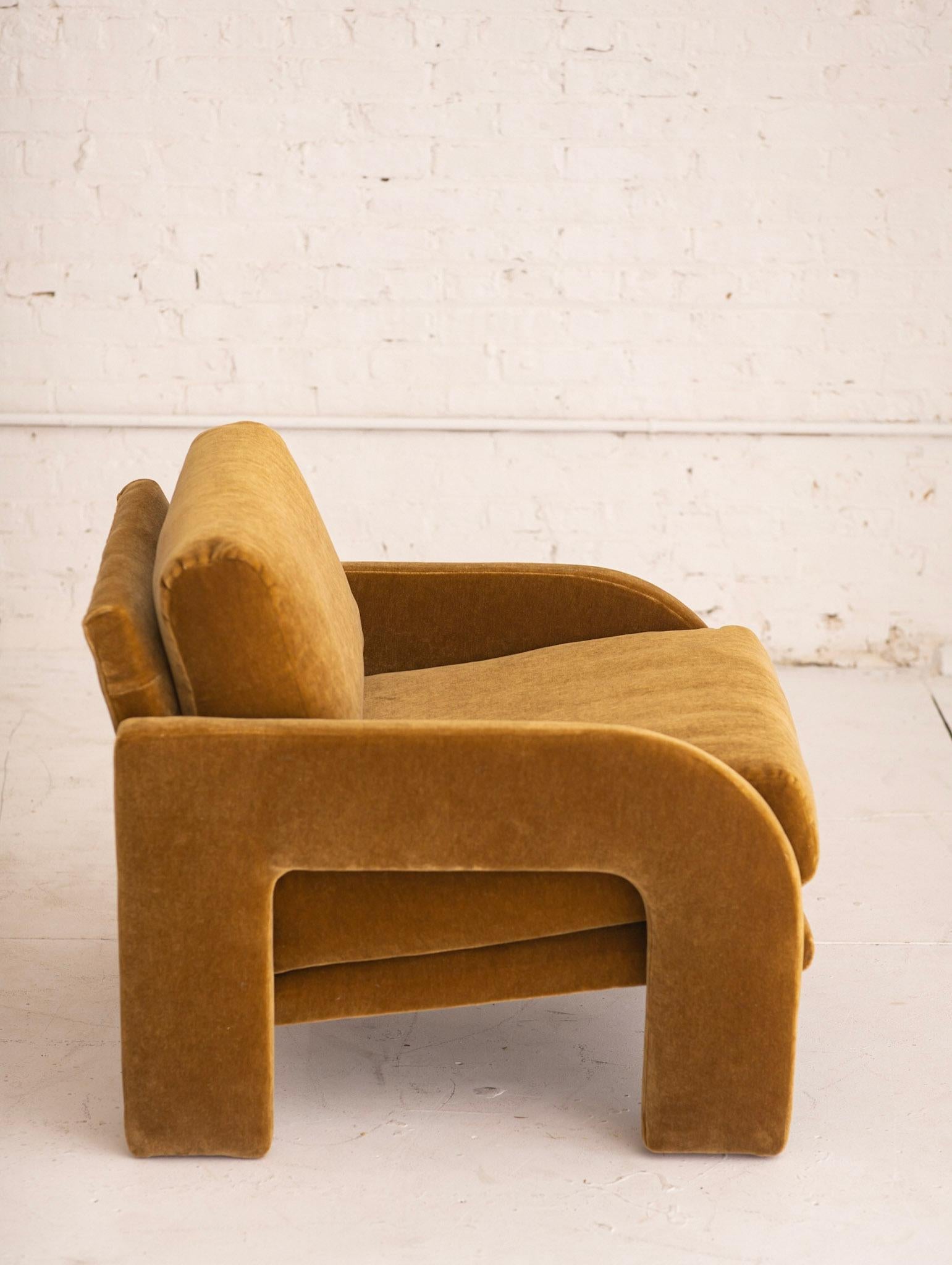 Post modern armchair with graphic architectural detail. Newly reupholstered in soft camel mohair.