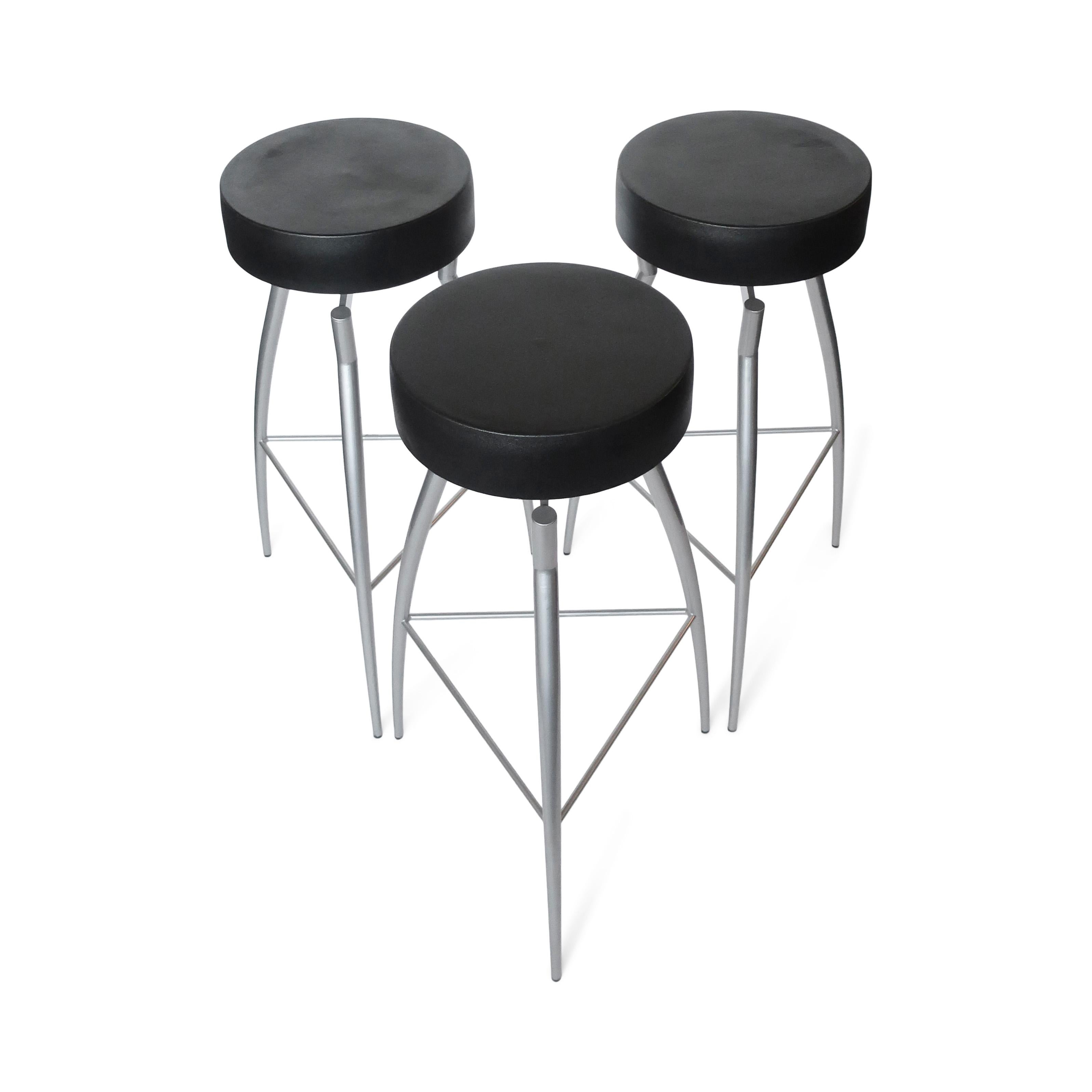 A set of three postmodern bar stools from the 1980s manufactured by Zeus Noto in Italy and designed by Claudio Nardi, an extraordinarily accomplished Italian, architect, interior designer, and industrial designer.  With gray powder-coated steel