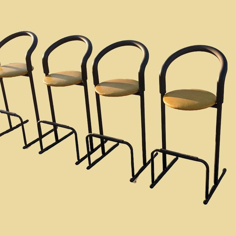 1980's Postmodern Barstools by Les Industries Amisco, Canada, Leather, Minimalist, Kitchen, Stools

Vintage from the 1980s
DIMENSIONS: 20ʺW × 20ʺD × 43.5ʺH
Seat Height: 30.5