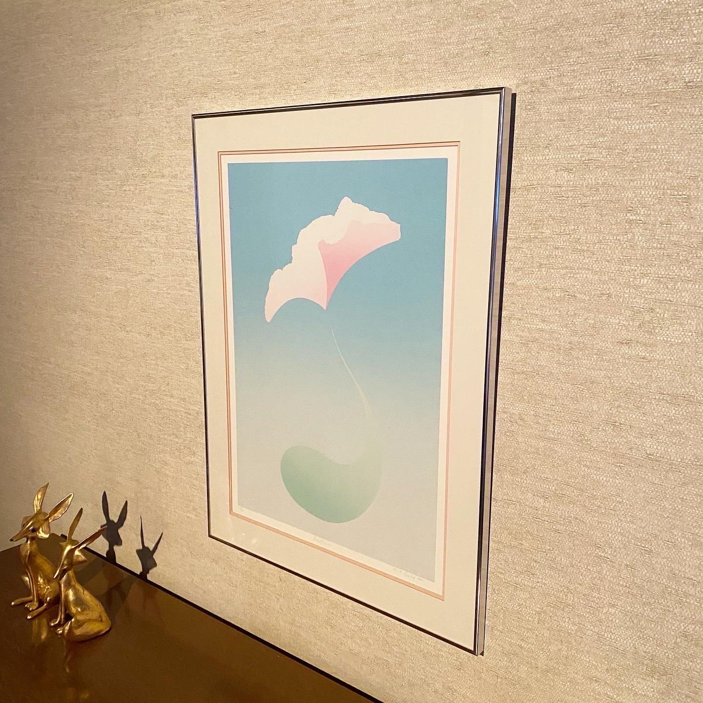 This is a gorgeous pair of  1980’s postmodern large framed lithographs by artist R. Gallup. Signed and numbered in pencil by the artist. 
“Rainflower” 12/20, 1982. pictured left: 24.75” wide x 32.75” high. 
 “Rainflowering” - 10/20, 1983. pictured
