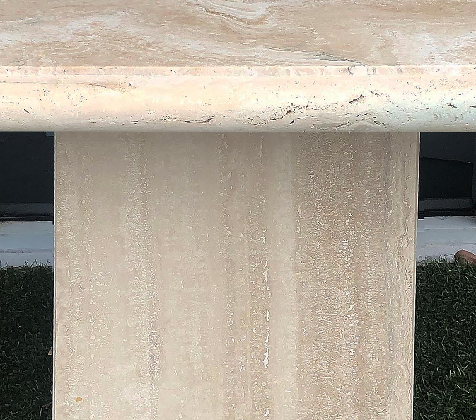 Italian Postmodern Brutalist travertine console table, 1980s

Offered for sale is a 1980s Postmodern Brutalist Italian travertine pedestal base console table. The substantial slab top is supported upon a matching rectangular travertine plinth.
 