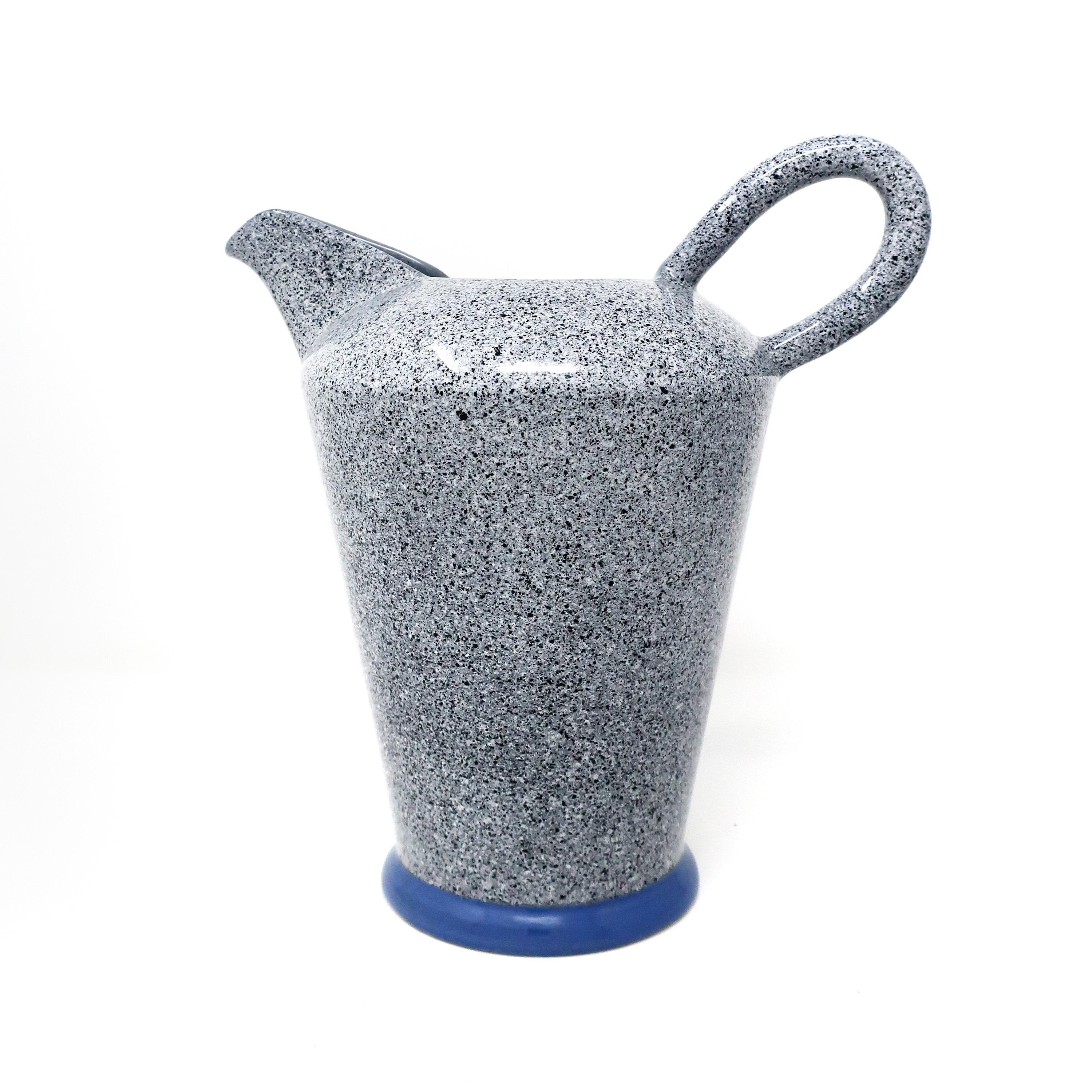 A 1980s pitcher by Italian ceramics manufacturer Baldelli. Gray, black and white speckled exterior, solid gray interior, and blue base.

In very good vintage condition. Signed on underside “Designed by Baldelli Italy”.

Measures: 9” x 6” x 9.5”.