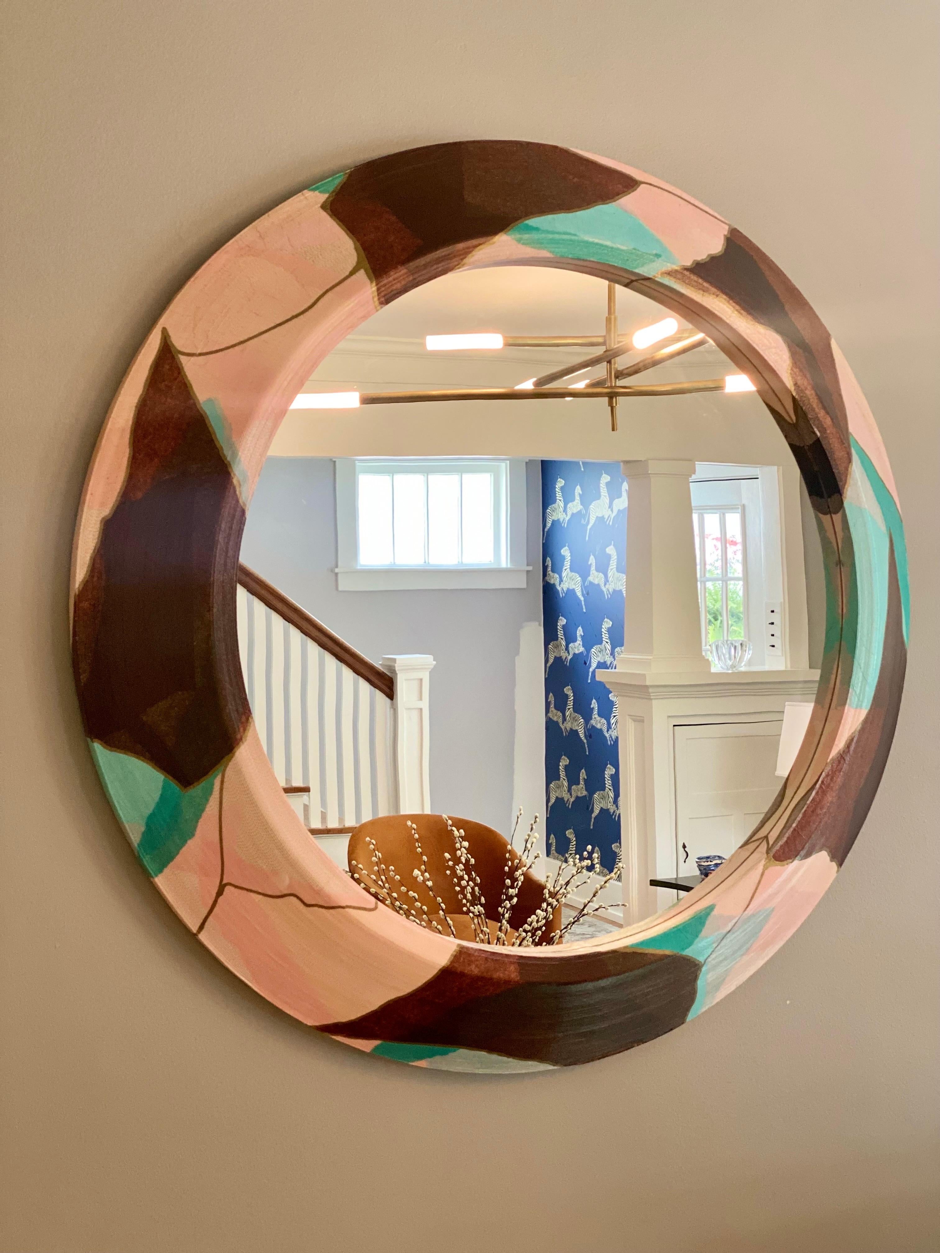 We are very pleased to offer a stunning round wall mirror by Charlotte & Jerry Garfinkle, for Flute Inc., circa the 1980s. Flute was a Chicago-based design company specializing in decorative accessories made of corrugated paper. Blurring the line