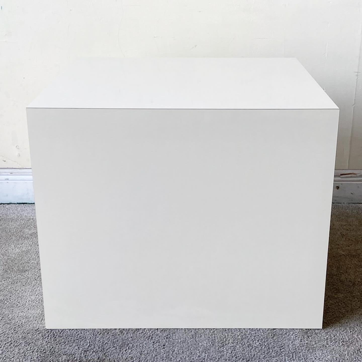 Exceptional postmodern side table. Features a cream lacquer laminate.
  
