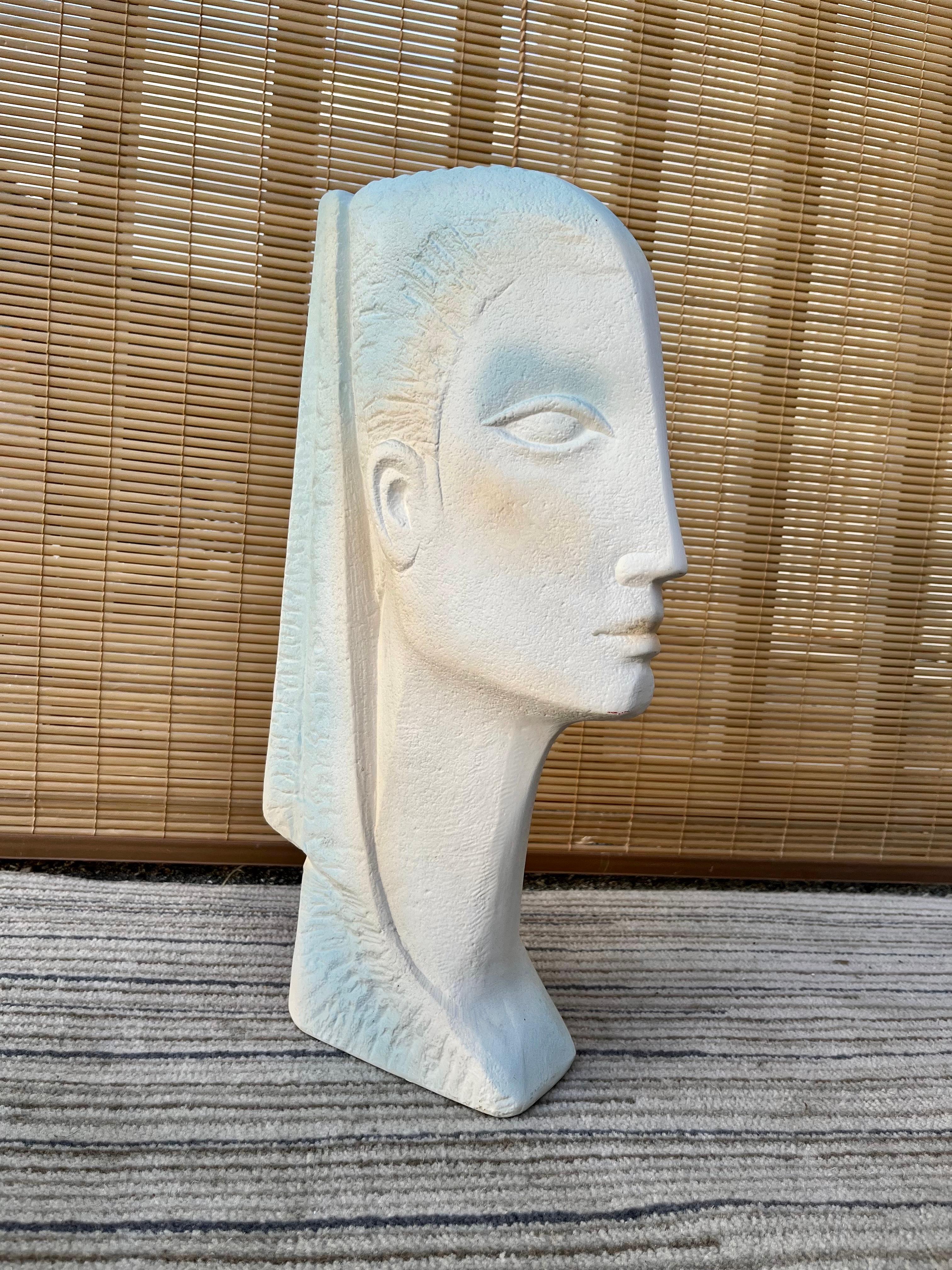 Vintage Large scale, Postmodern / 1980s Art Deco revival Female Head Ceramic Sculpture in the Austin Productions Style. Circa 1980s
Features a flatten female head figure molded on a hollow textured off-white ceramic with pastel colors accent
